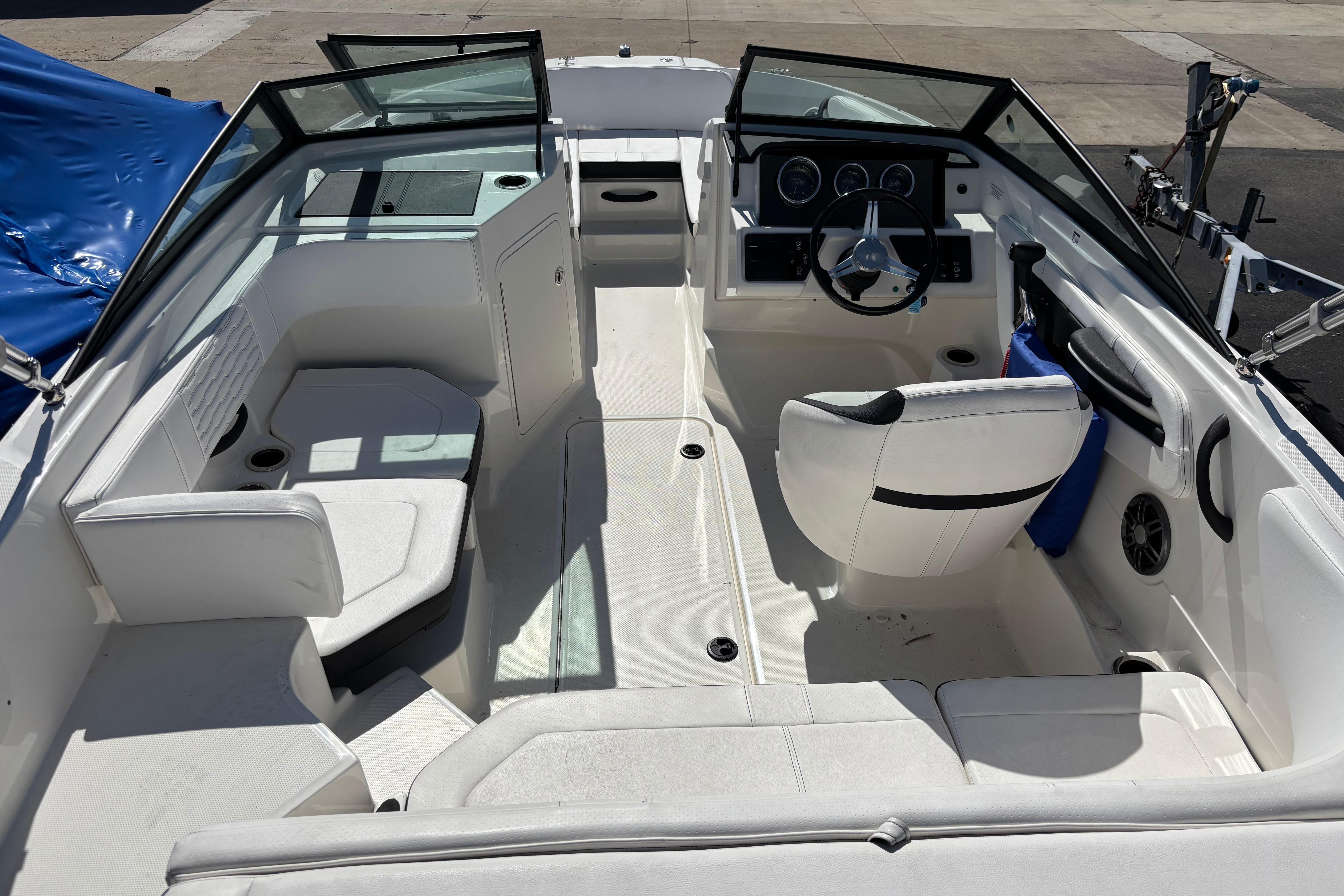 2022 Sea Ray SPX 190 Outboard boat interior with seating and steering console.