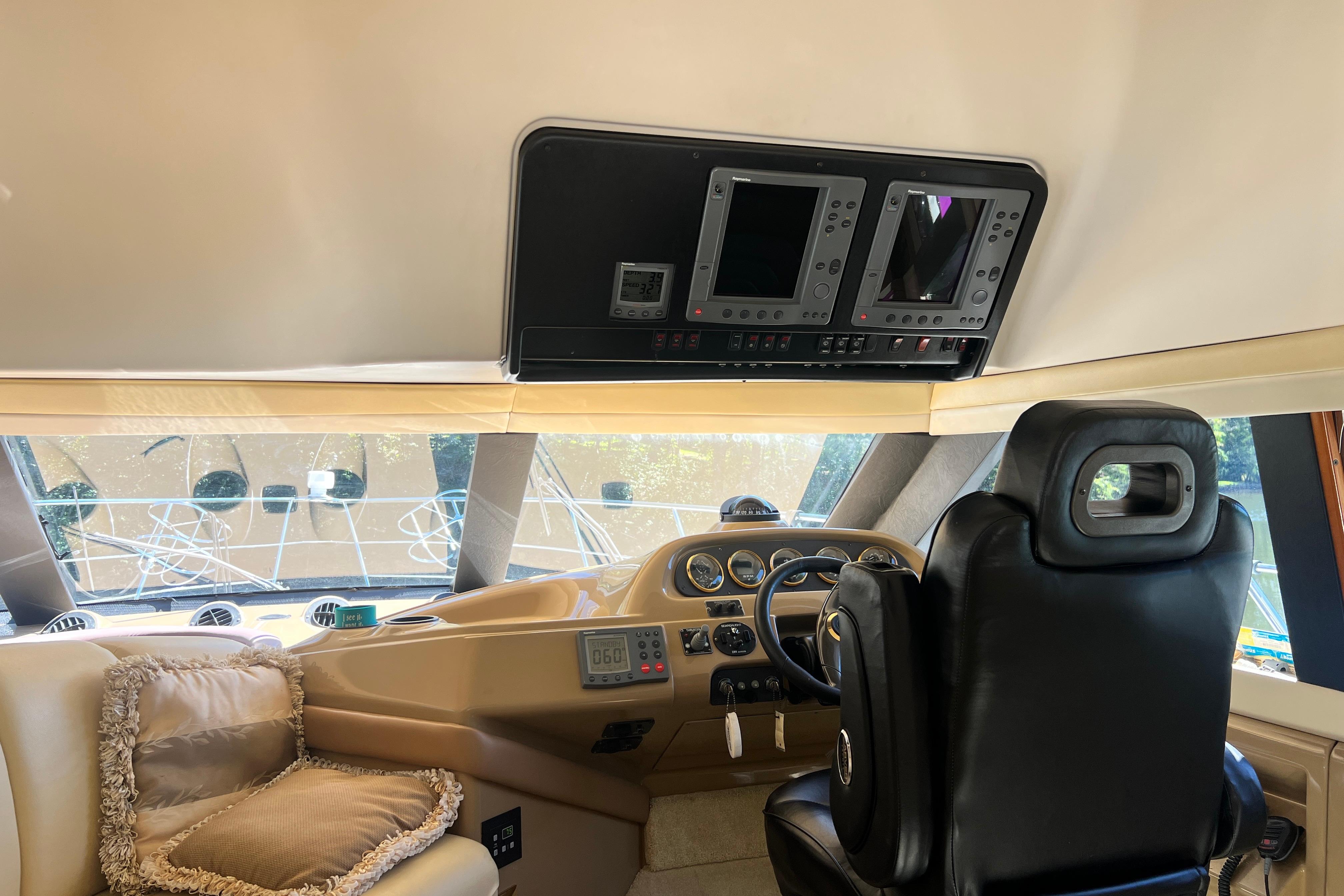 Interior of 2003 Carver 450 Voyager Pilothouse with helm and navigation equipment.