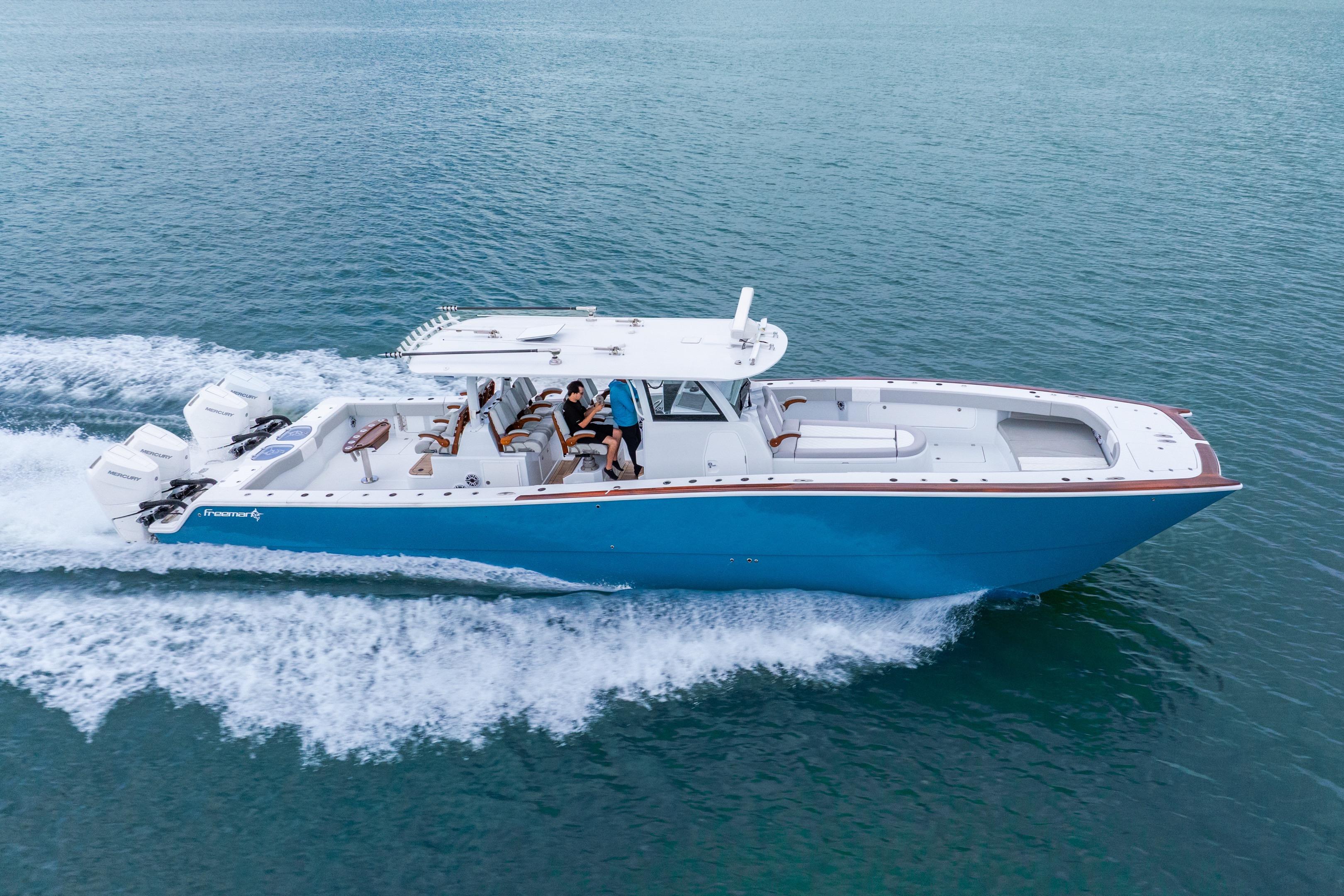 2024 Freeman 47 boat cruising on open water, showcasing sleek design and powerful engines.