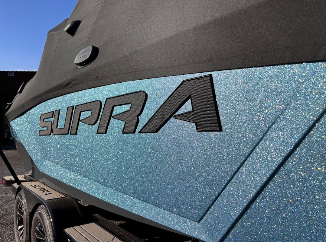 2025 Supra SA 450 boat with sparkling blue finish.
