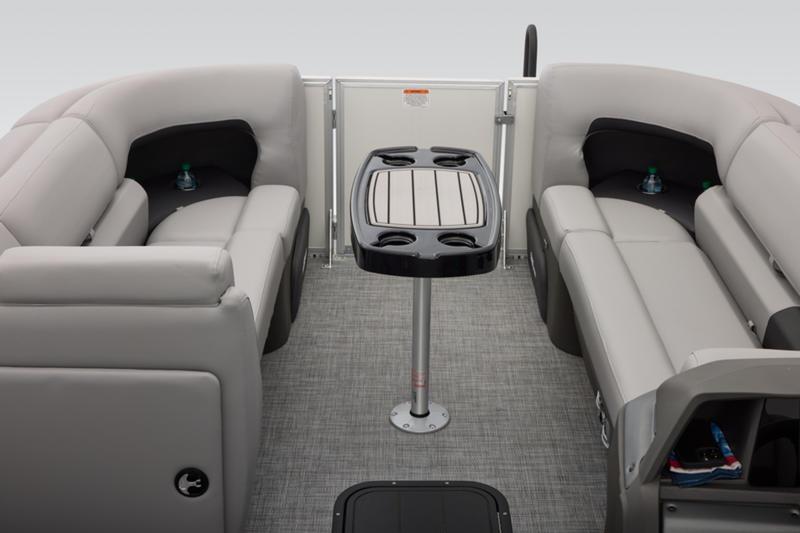 2026 Sun Tracker Party Barge 22 DLX interior with seating and table.