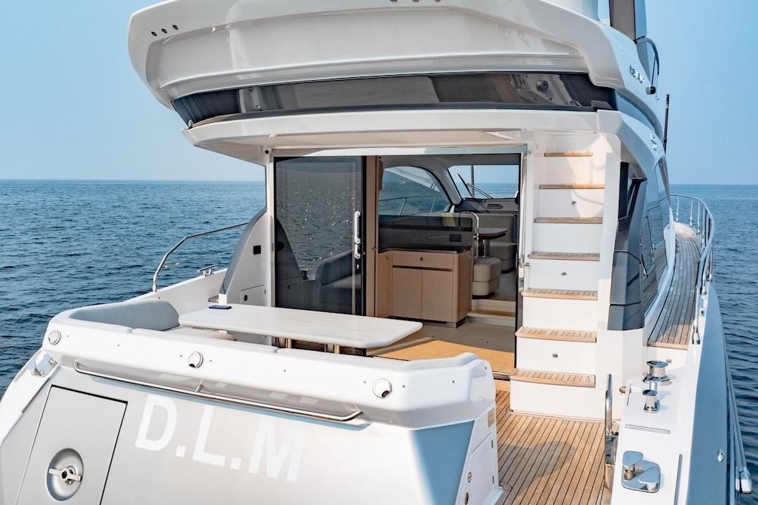2023 Azimut Fly 53 yacht with open deck and luxurious interior on the ocean.