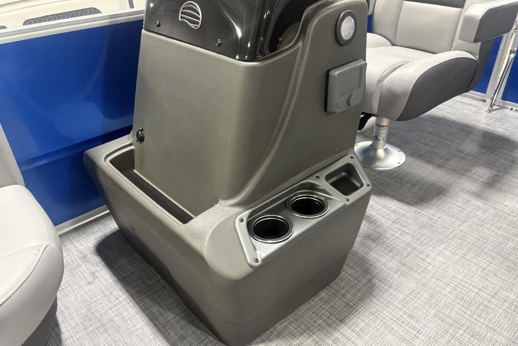 2026 Sun Tracker Party Barge 16 DLX console with cup holders and seating.