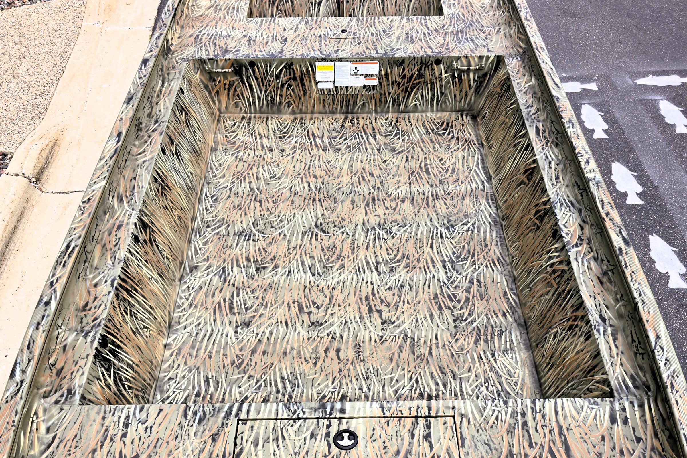 2026 Tracker GRIZZLY 1860 Utility boat with camouflage interior design.