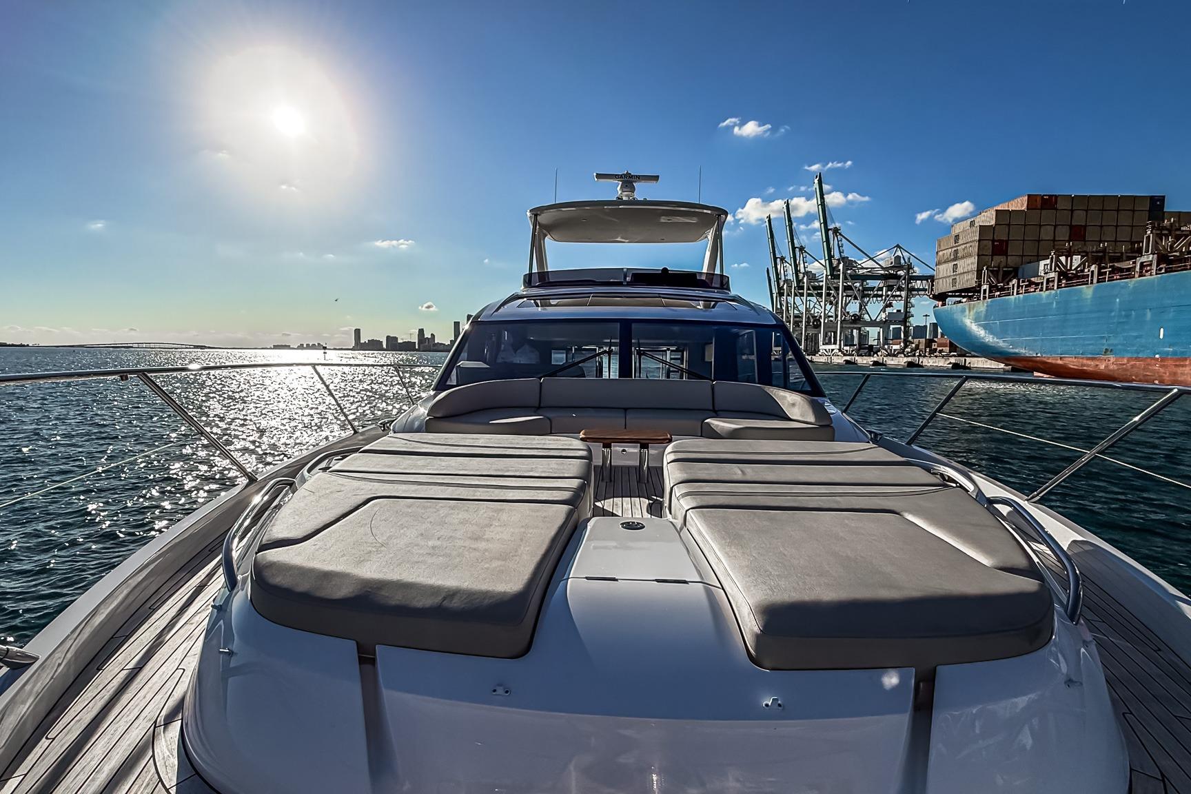 Luxurious 2026 Princess S65 Sportbridge yacht docked in a sunny harbor.