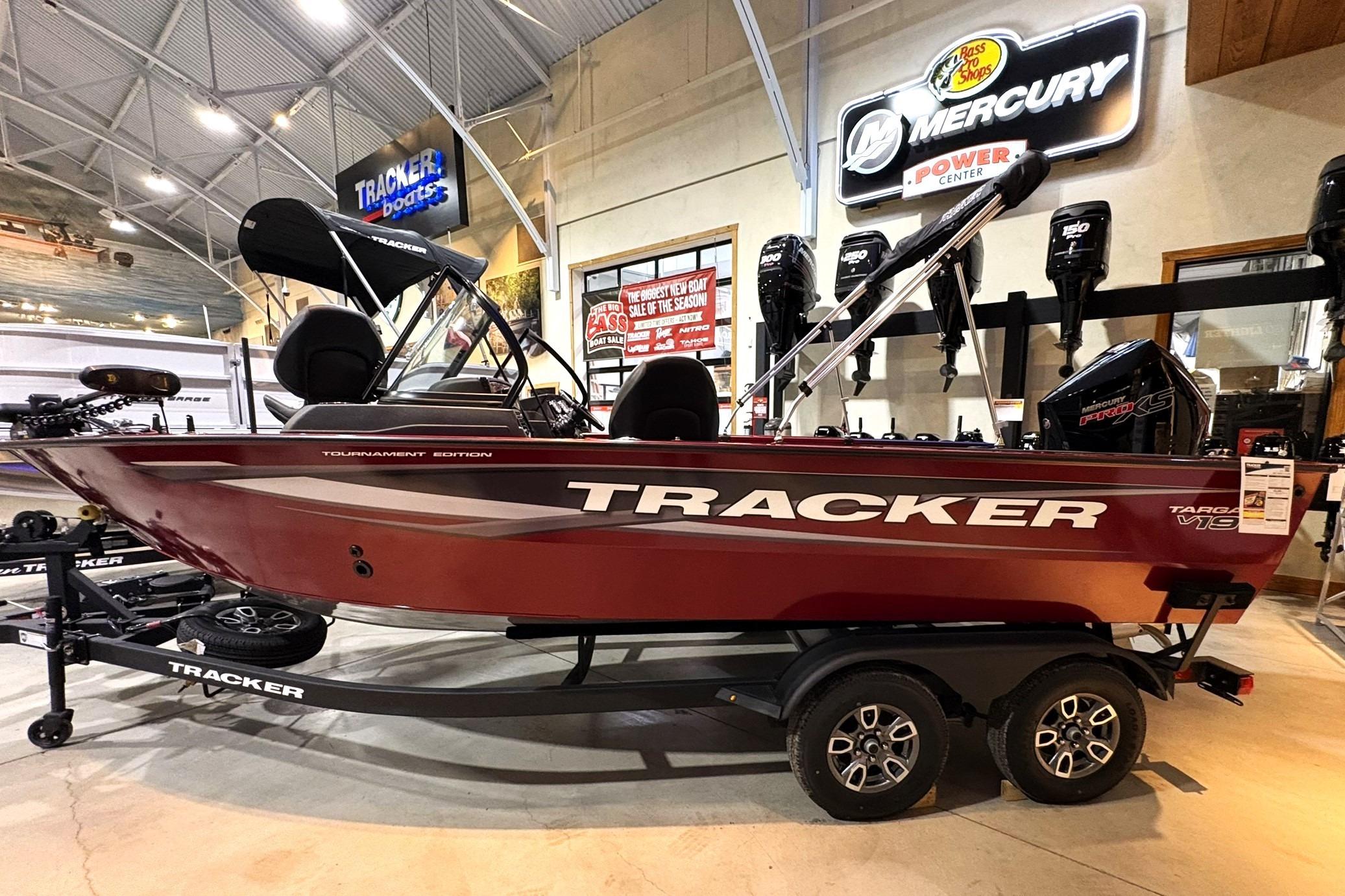 2025 Tracker Targa V-19 WT boat displayed indoors with Mercury engine signage.