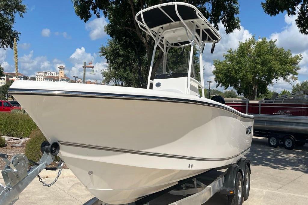 2026 Mako 214 Center Console boat on trailer, parked outdoors.