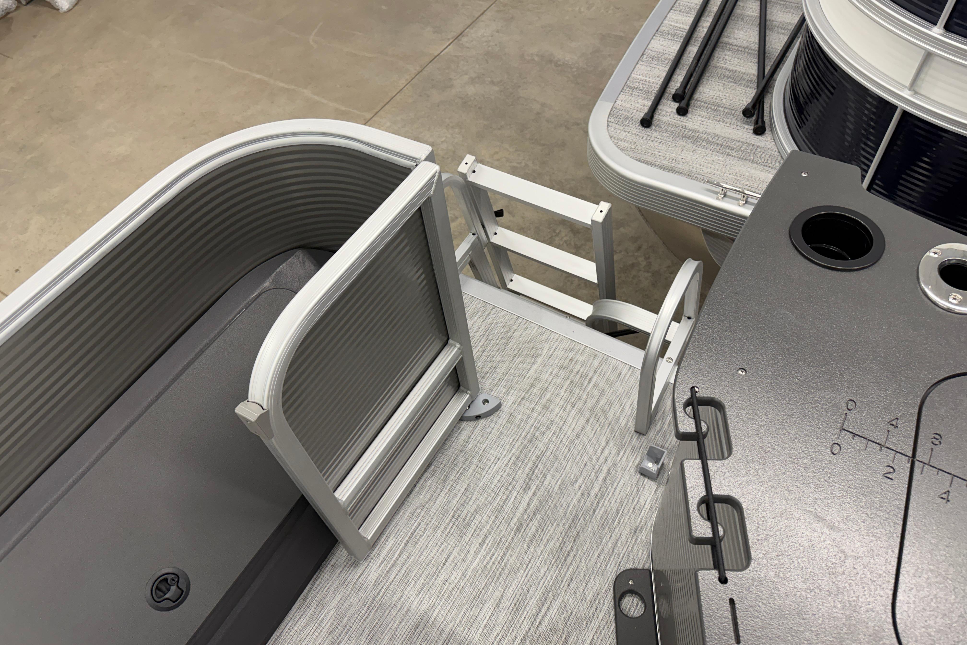 2026 Bennington 20 SF boat interior with ladder and seating area.