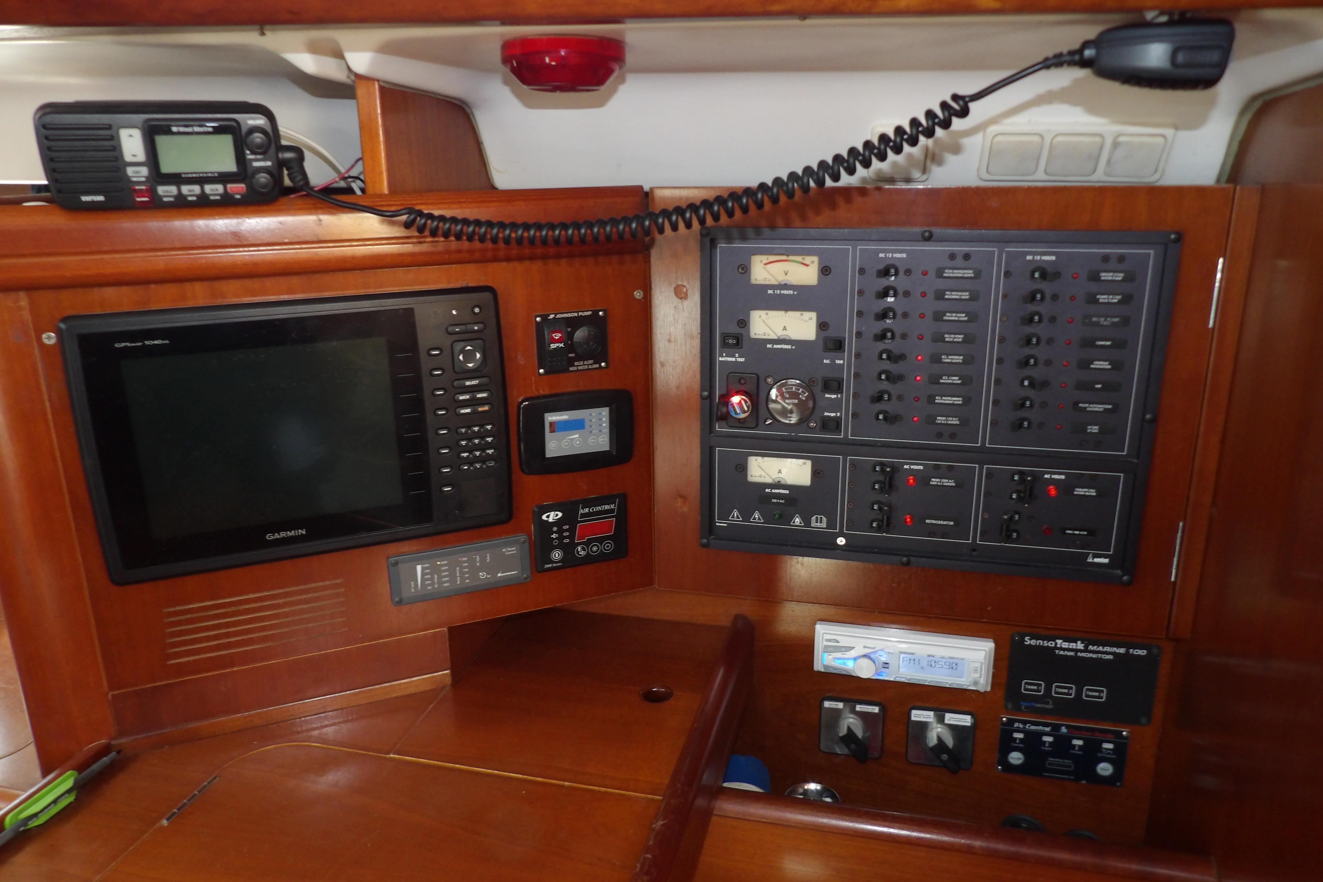 Control panel of a 2001 Beneteau 473 yacht with navigation and communication equipment.