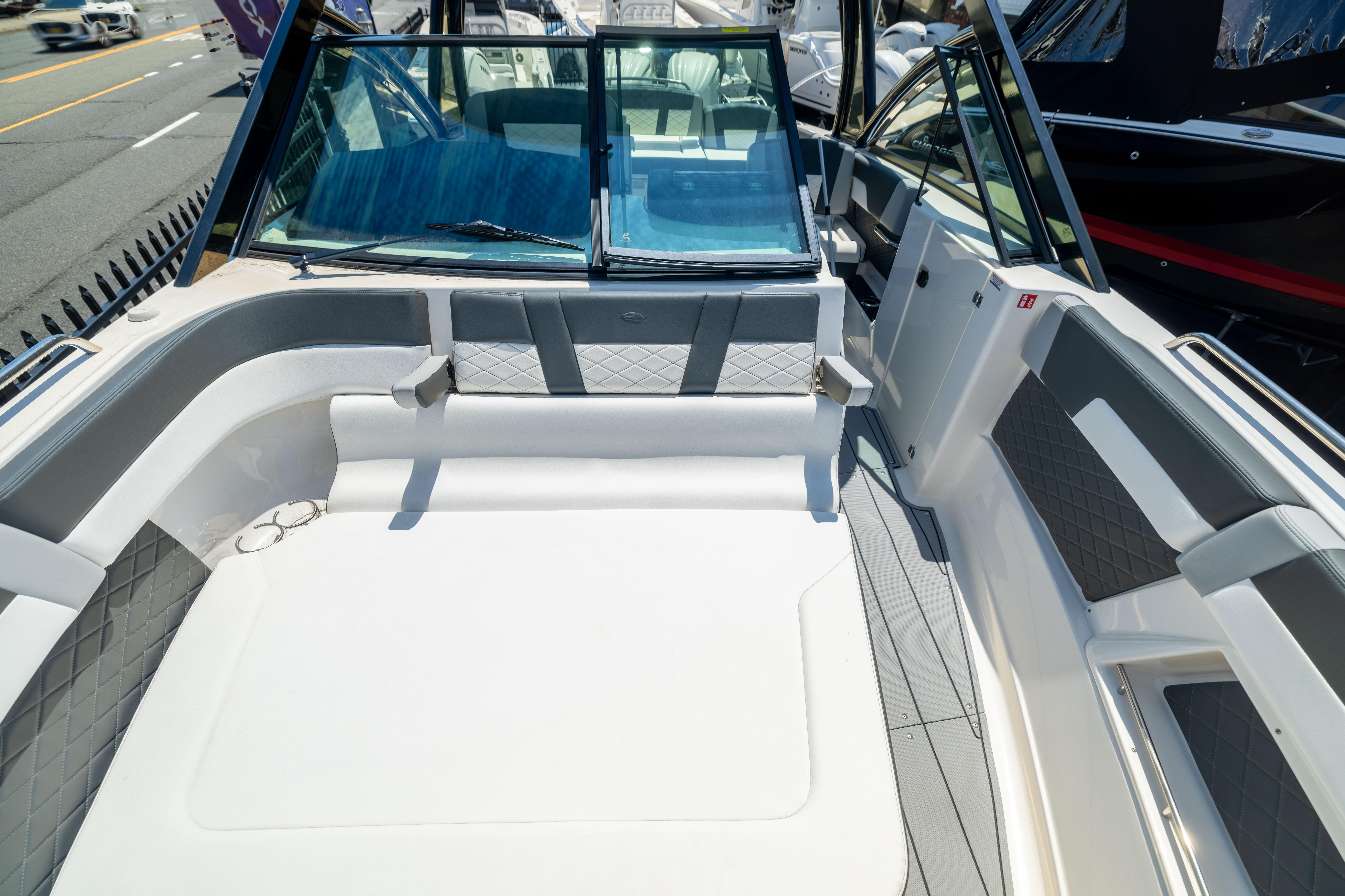 2026 Chaparral 310 OSX boat interior with luxurious seating and modern design.
