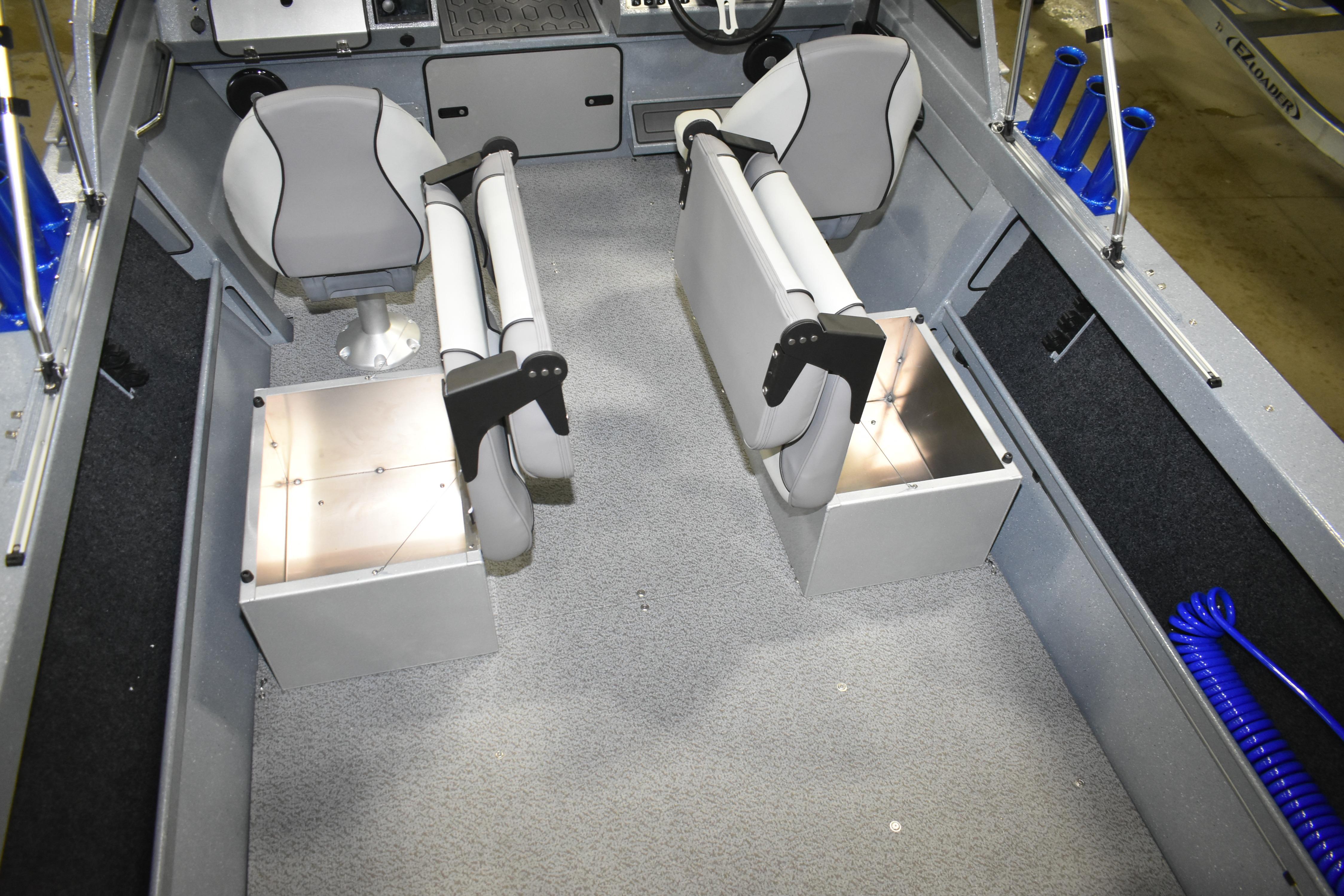Interior of 2026 KingFisher 1825 Falcon boat with seating and storage compartments.