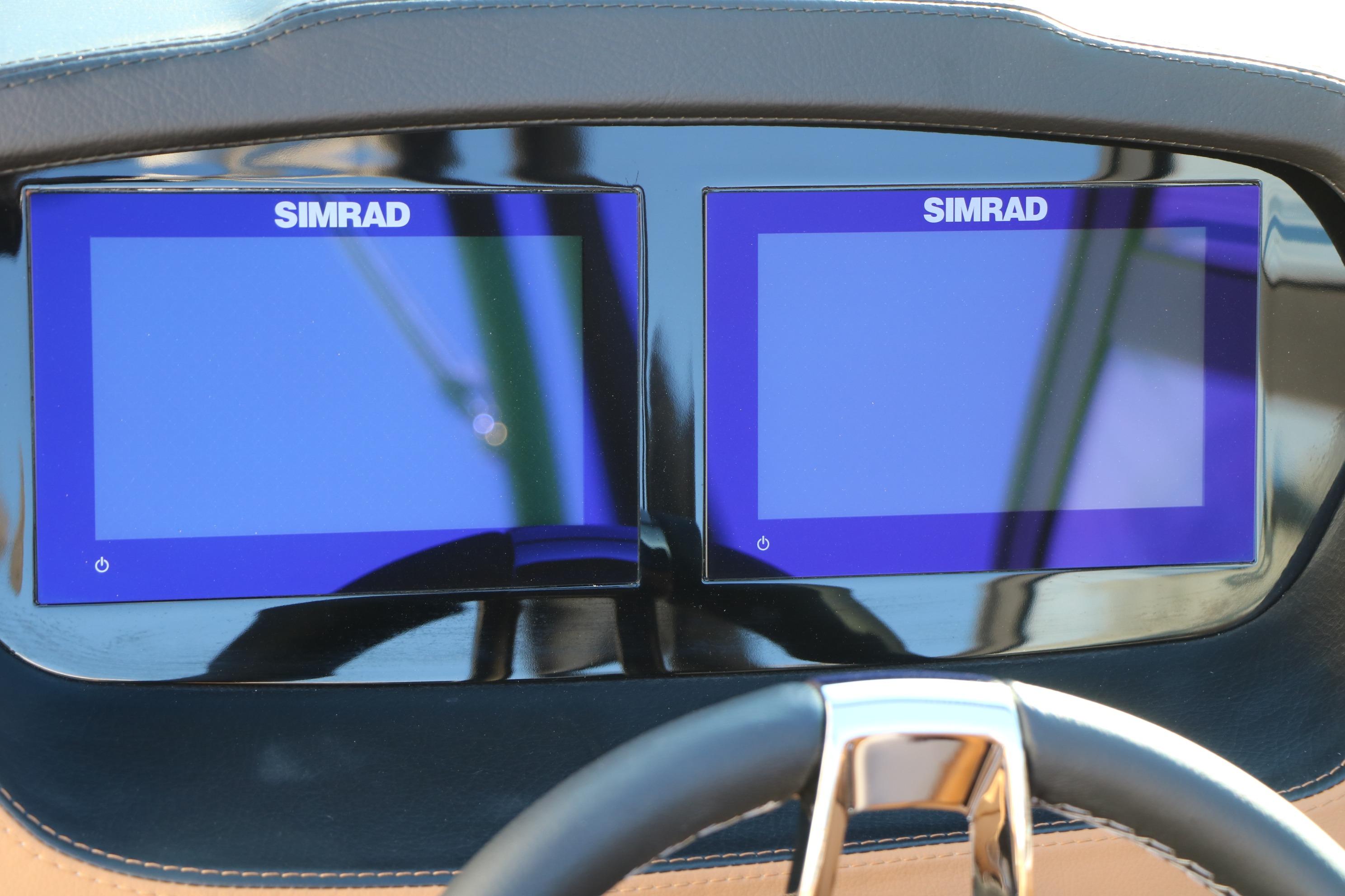 Dual Simrad displays on 2026 Chaparral 247 SSX boat dashboard.