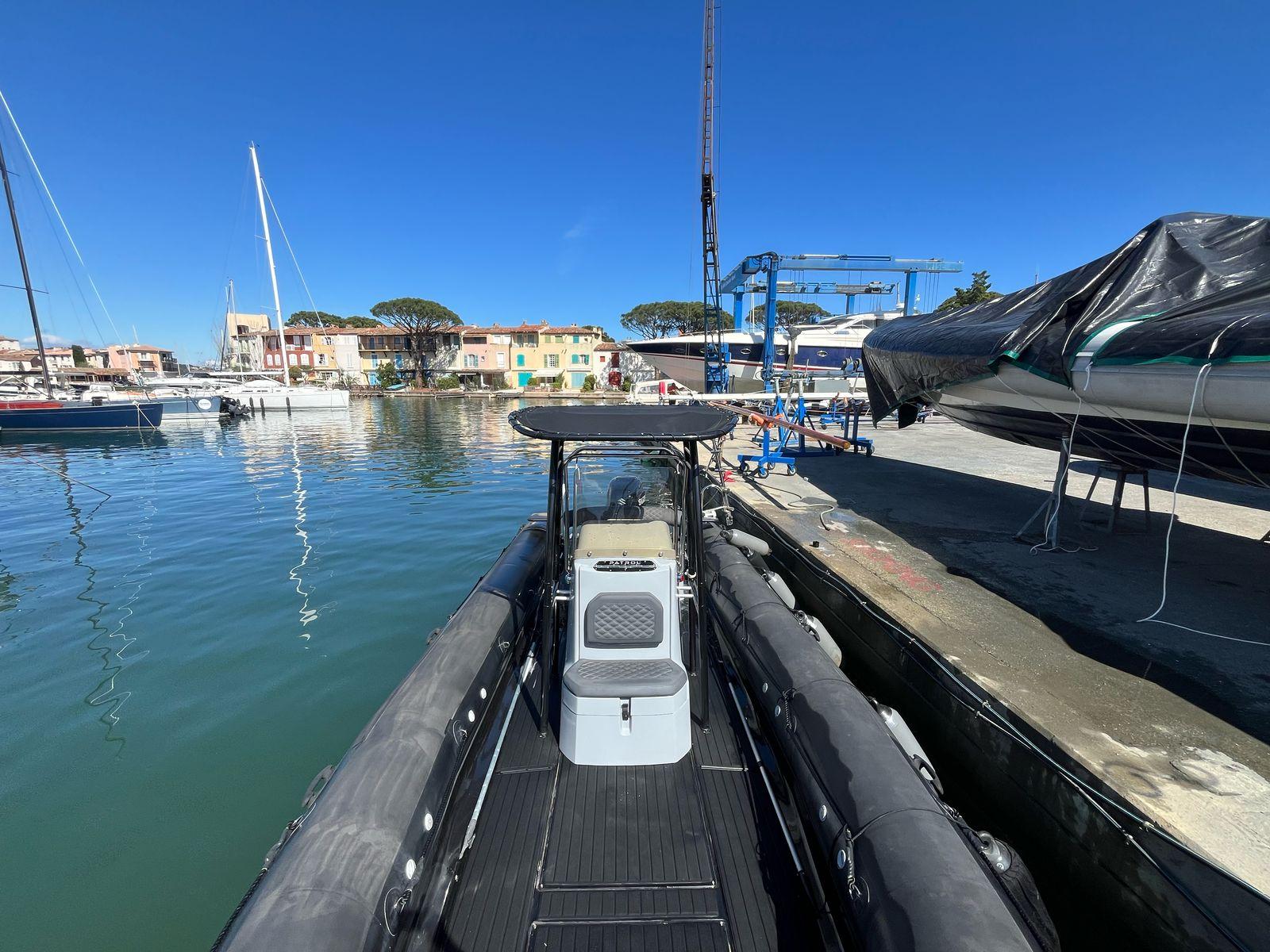 3D Tender 860 Patrol 2022 docked at a marina under clear blue skies.