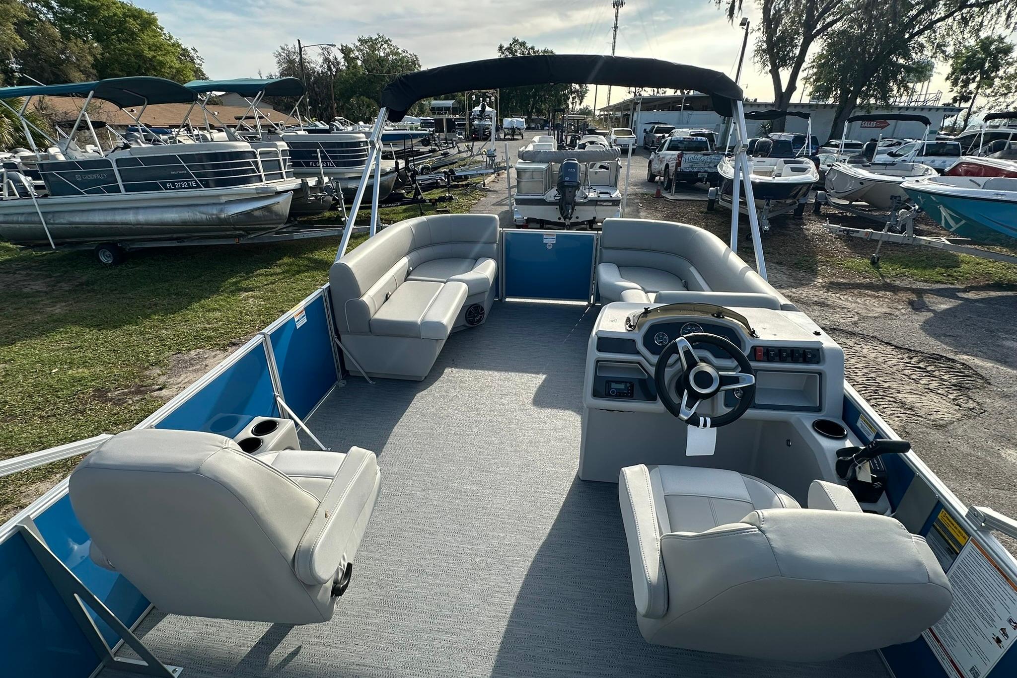 2026 Sweetwater EX 2286 SFLX pontoon boat with spacious seating and modern helm.