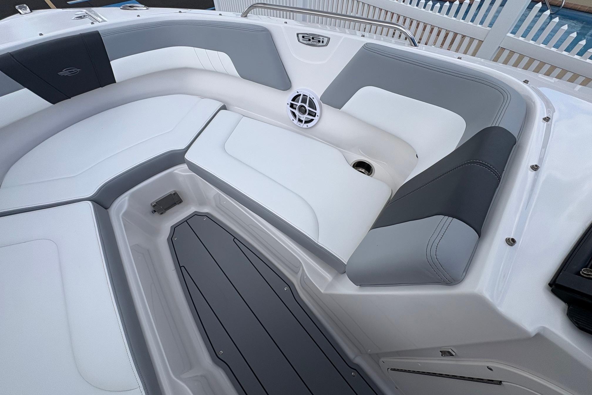 Interior view of 2026 Chaparral 23 SSi OB boat, featuring sleek seating and modern design.