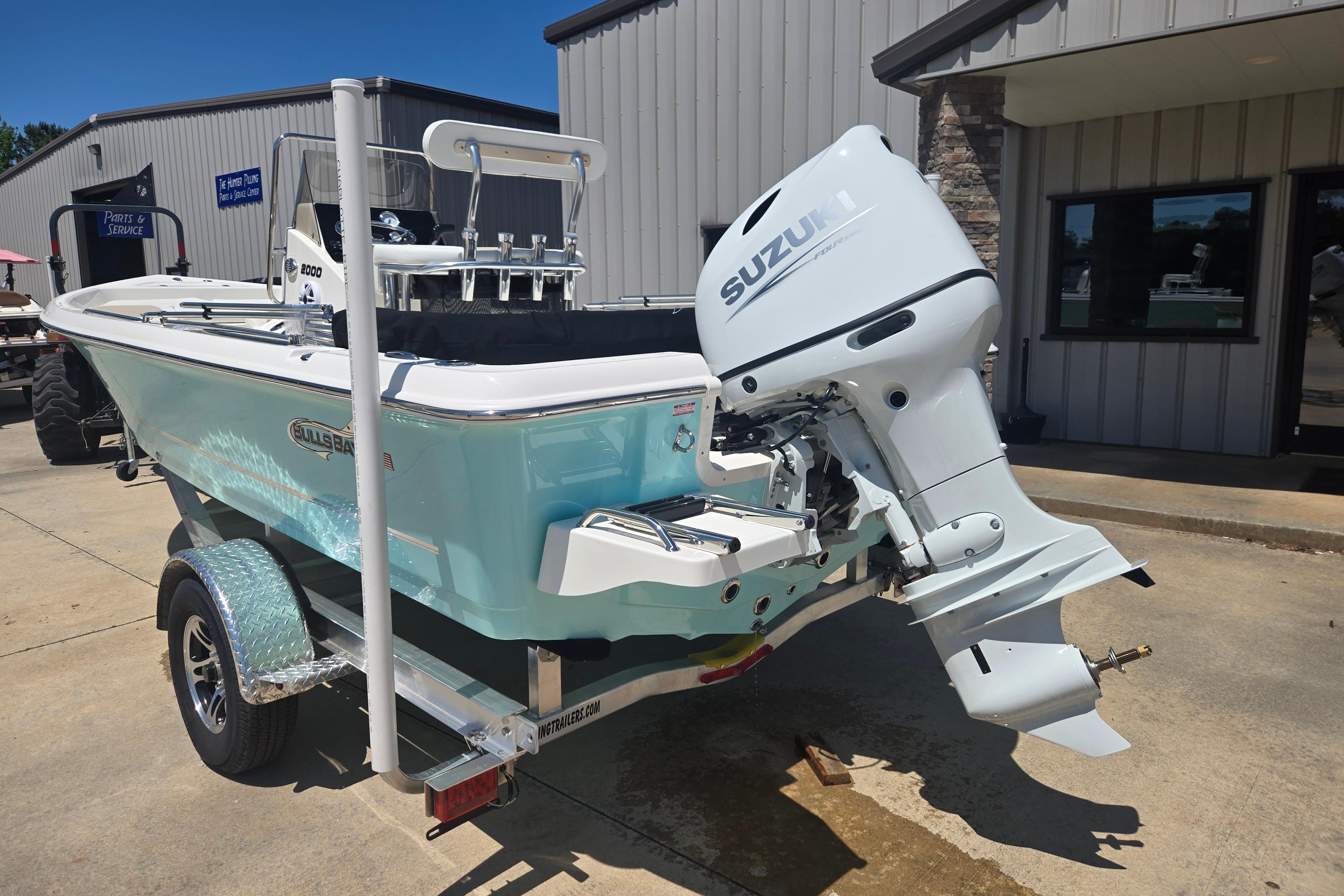 2026 Bulls Bay 2000 boat with Suzuki outboard motor on a trailer.