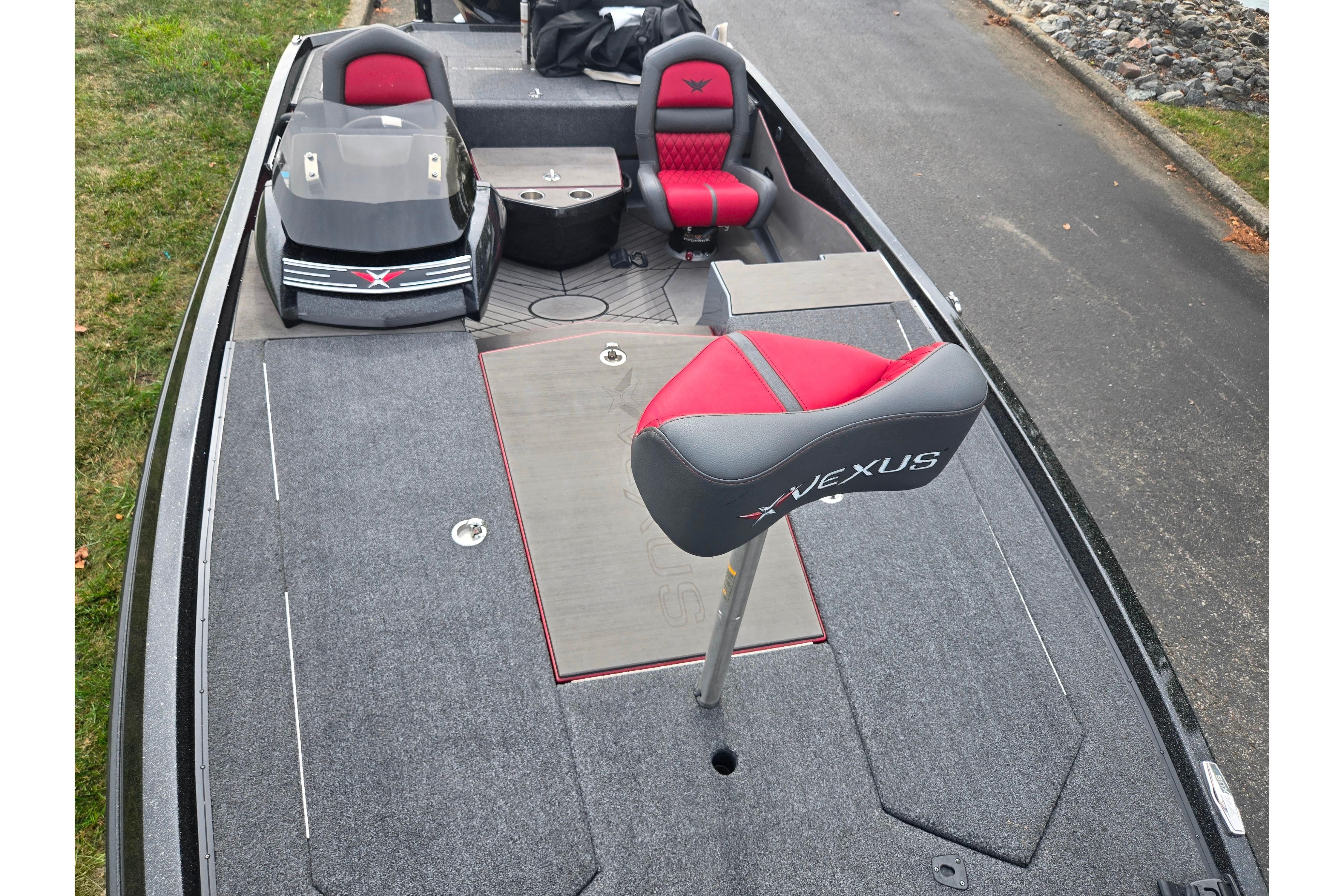 2022 Vexus VX20 boat interior with red and gray seating, sleek design, and spacious deck.