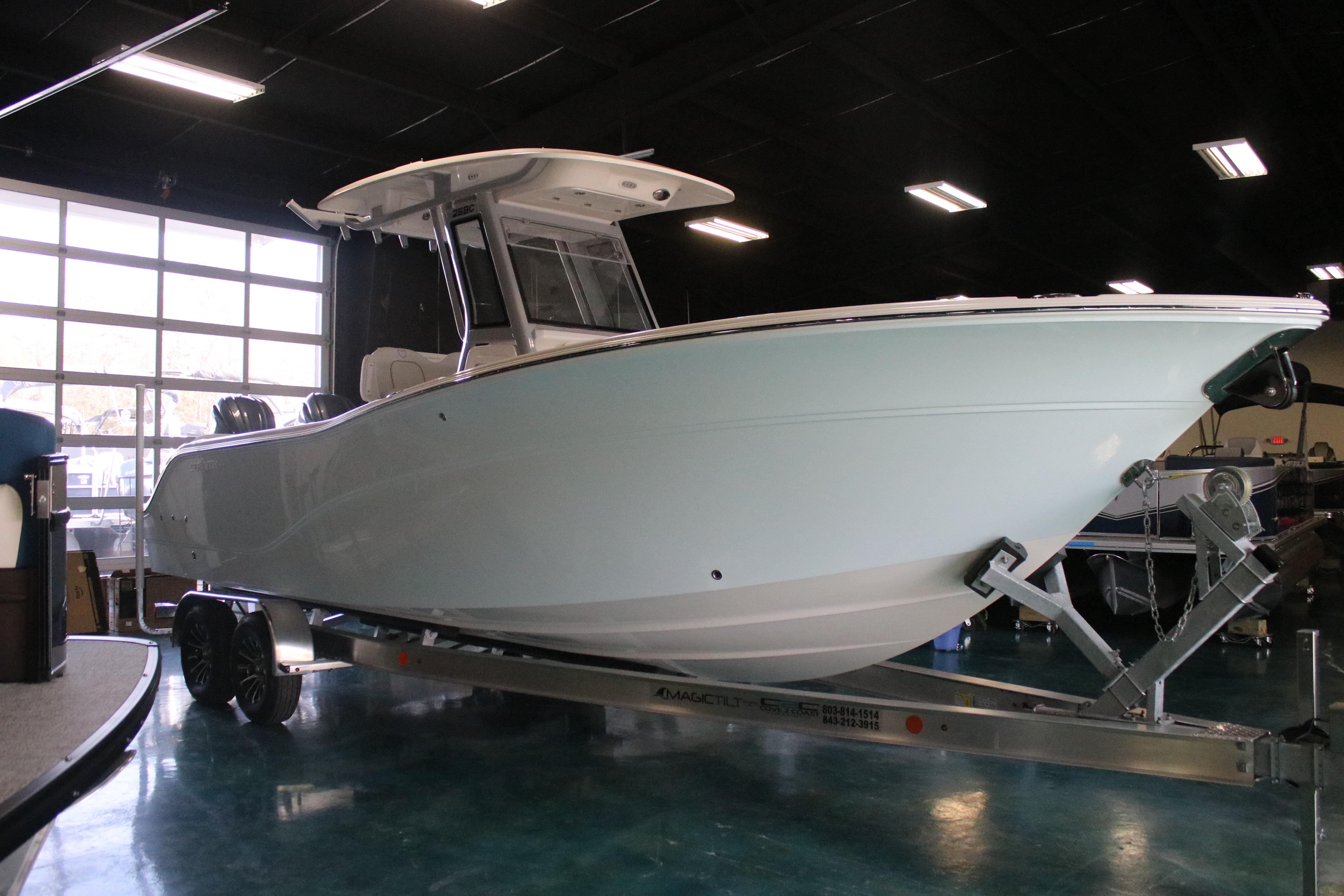 2026 Sea Fox 268 Commander boat on trailer in showroom.