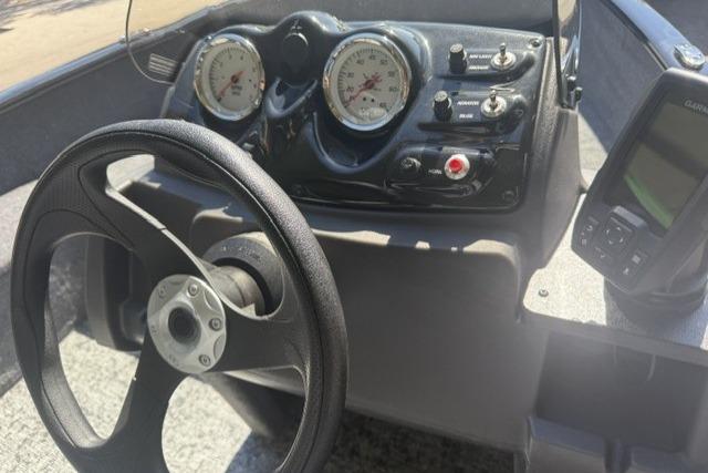 Steering wheel and dashboard of 2026 Tracker Super Guide V-16 SC boat.