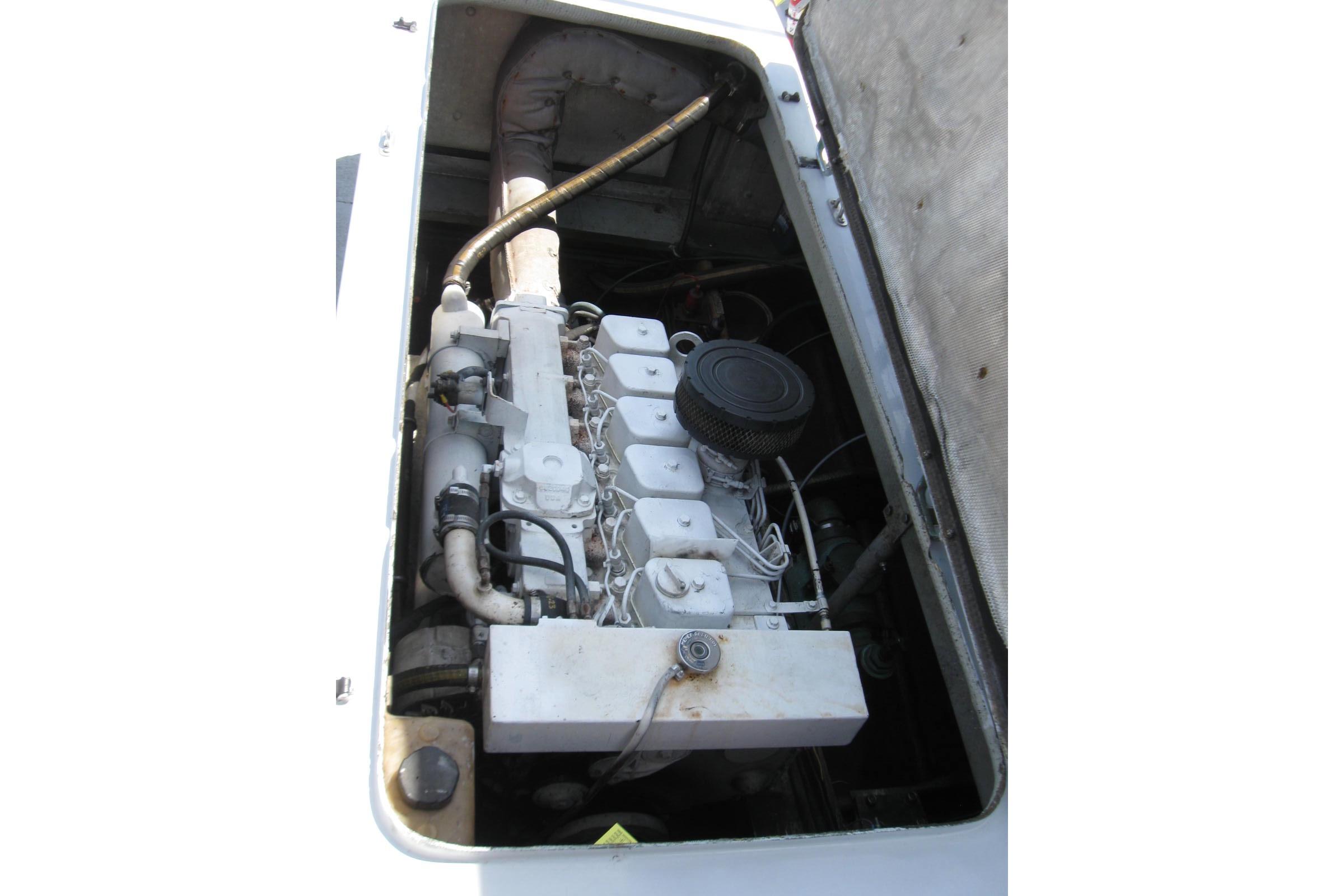 Engine compartment of a 1994 Willard US Navy vessel, showcasing mechanical components.