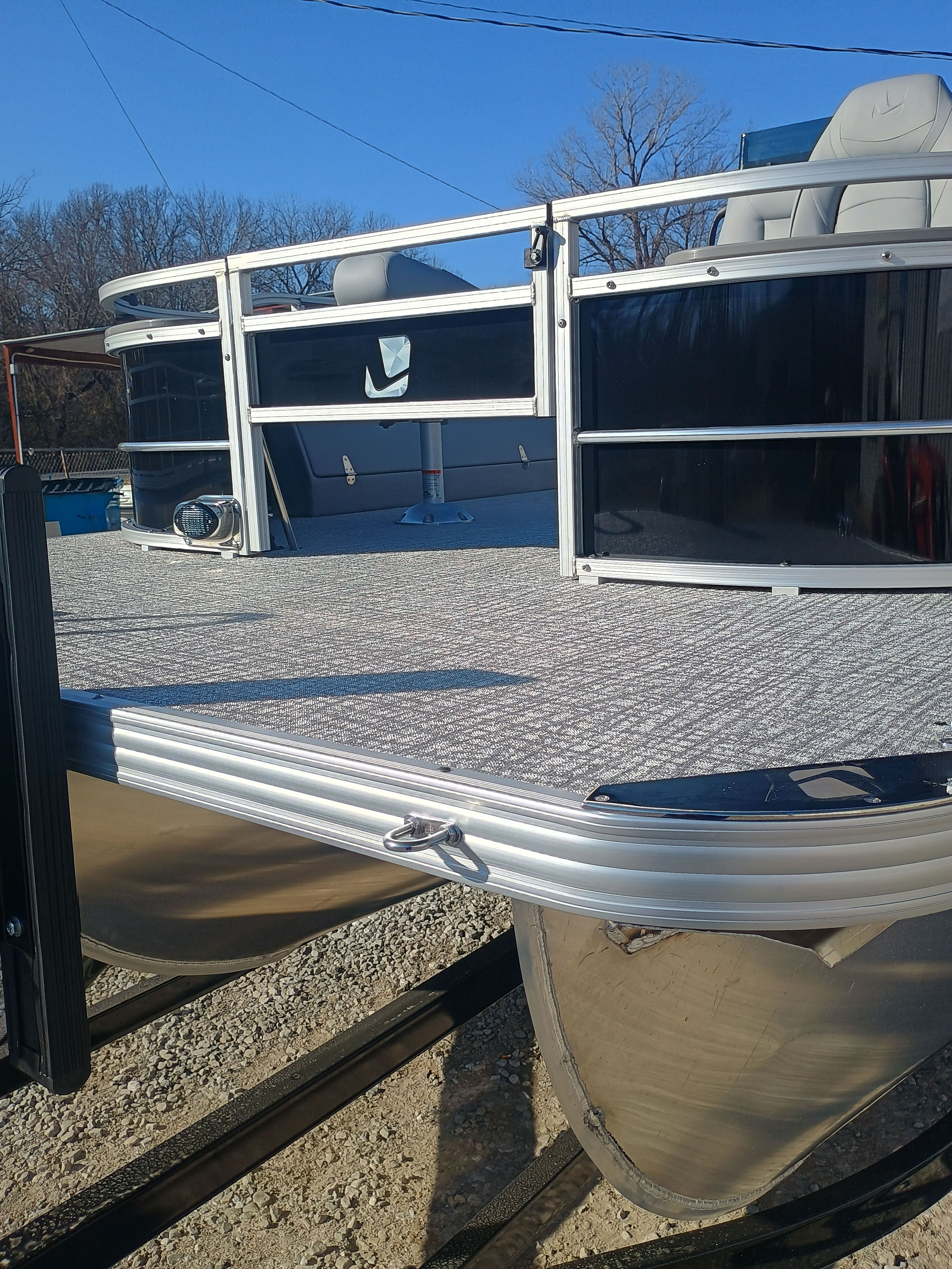 2026 Landau Alure 25CC Fish-Black pontoon boat on trailer.