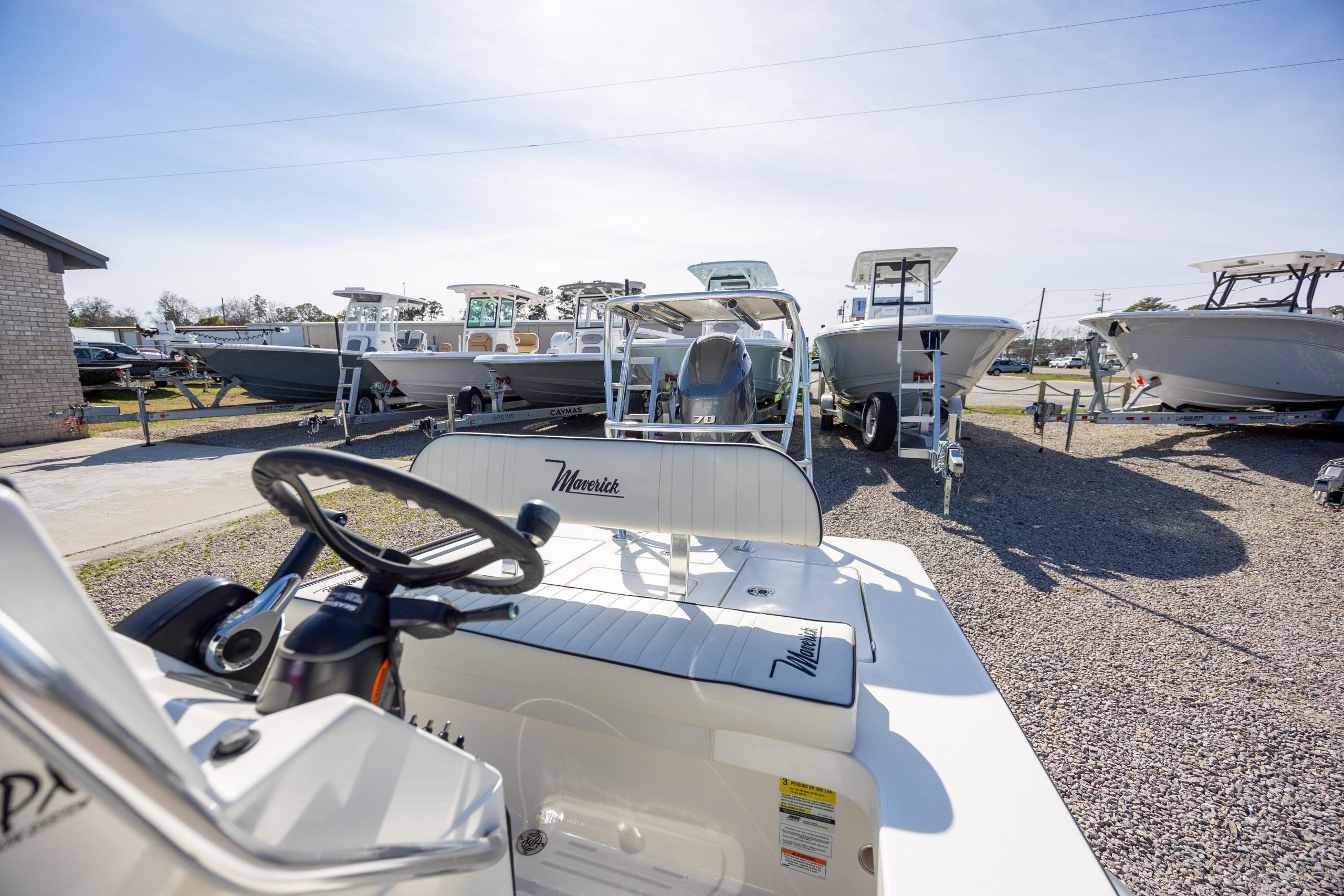 2024 Maverick 17 HPX-S boat displayed in a dealership lot under clear skies.