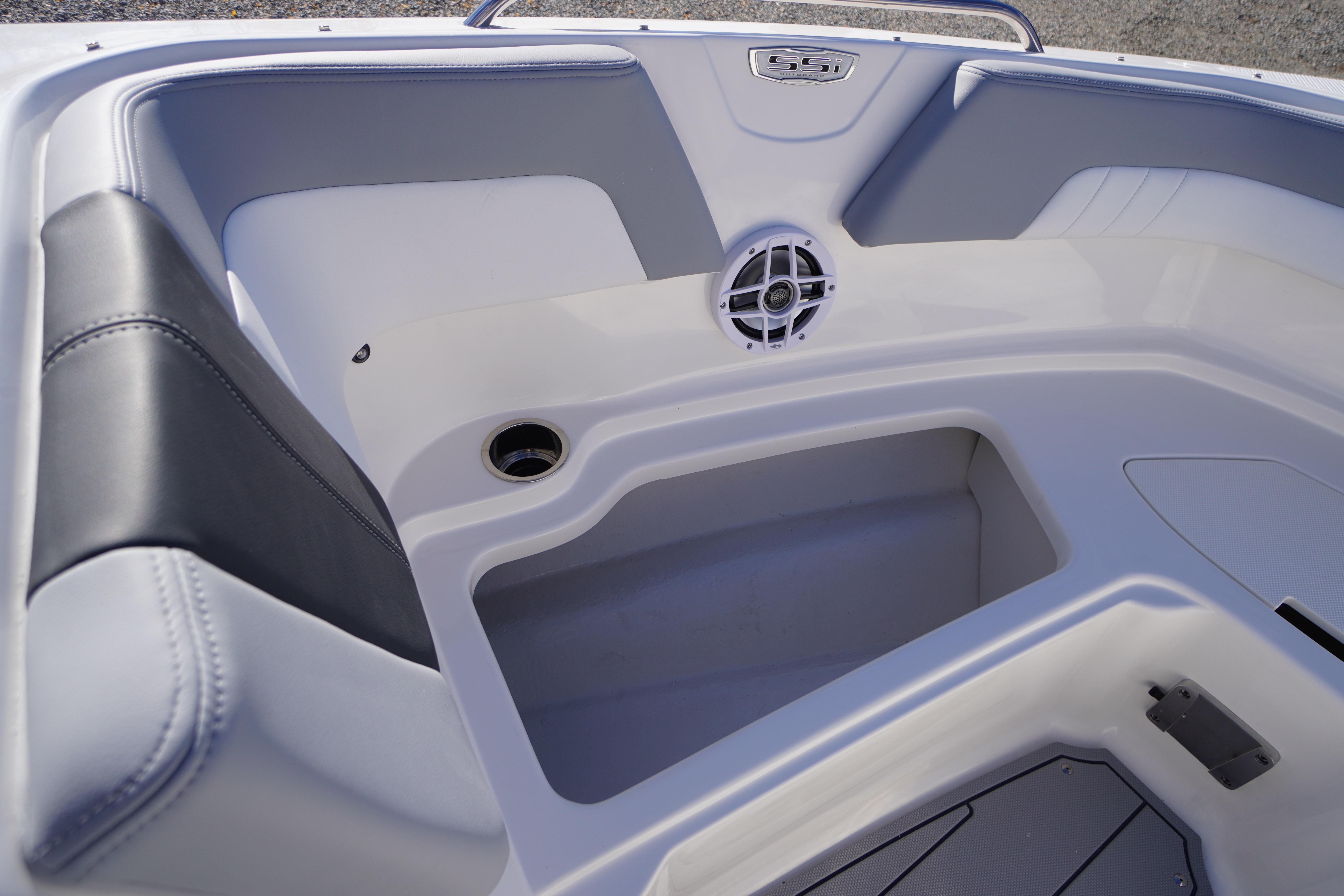 2026 Chaparral 23 SSi OB boat interior with seating and speaker detail.
