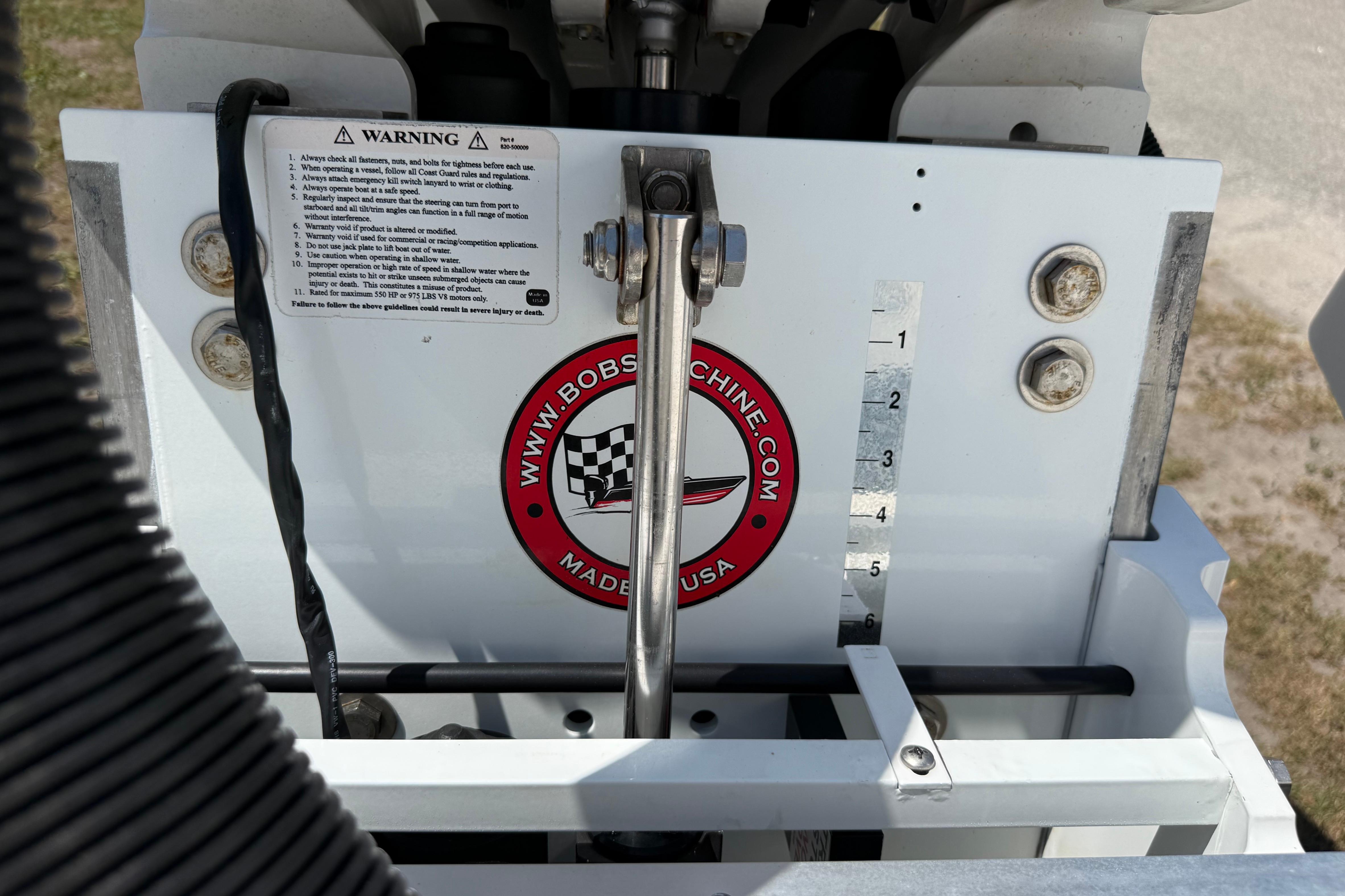 2023 Regulator 26XO boat engine component with warning label and Bob's Machine logo.