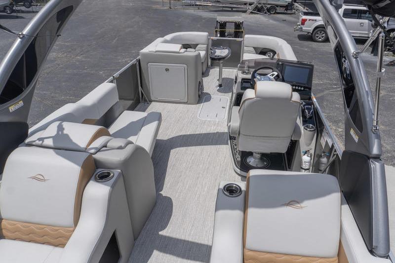 Luxurious interior of 2026 SunCatcher Elite 326 SS pontoon boat with plush seating and modern helm.