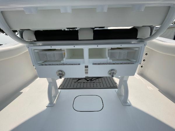 2025 Tidewater 232 CC Adventure boat interior with storage compartments and seating.