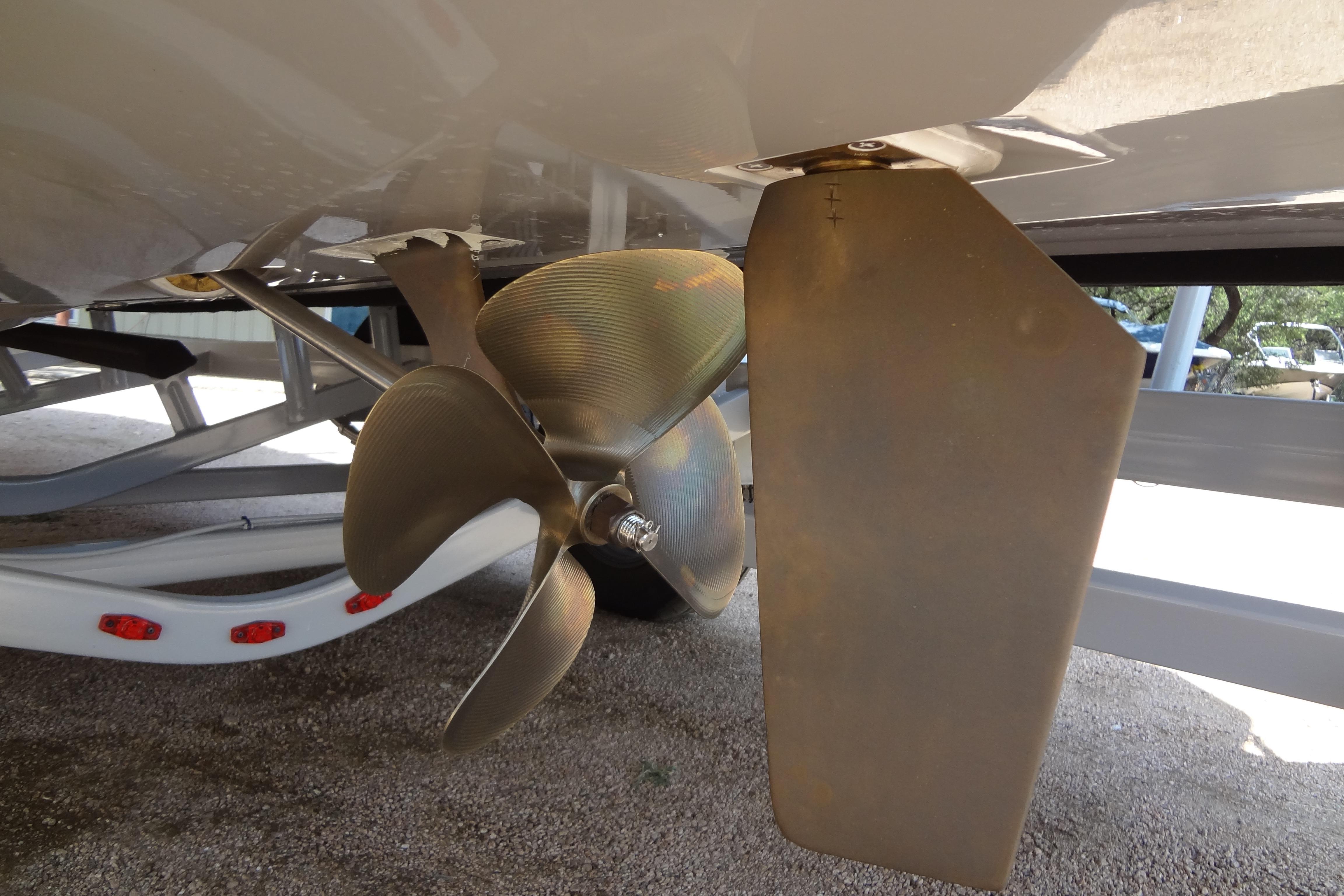 Propeller and rudder of 2022 ATX Surf Boats 24 Type-S on trailer.