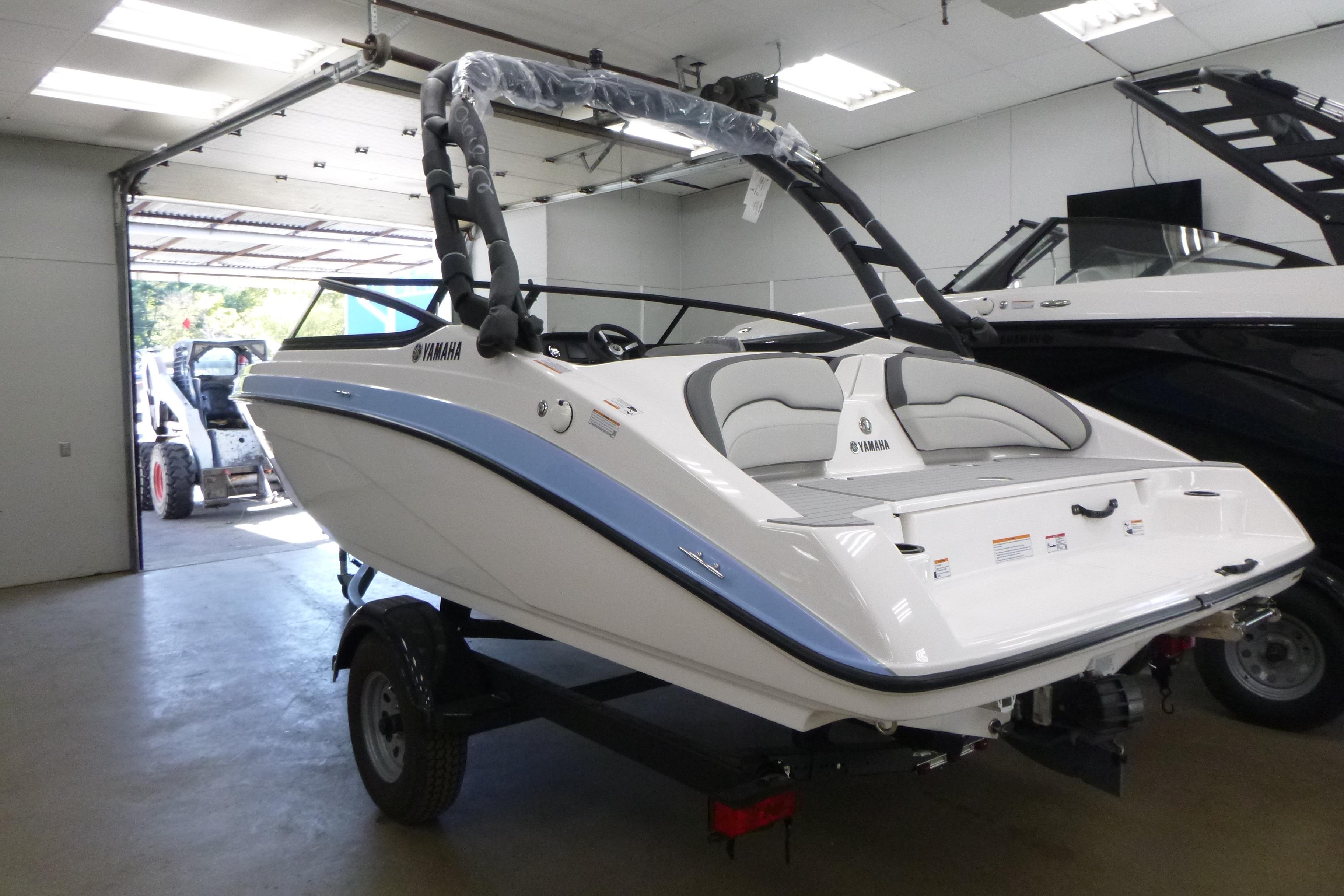 2026 Yamaha AR190 boat in showroom, featuring sleek design and modern amenities.