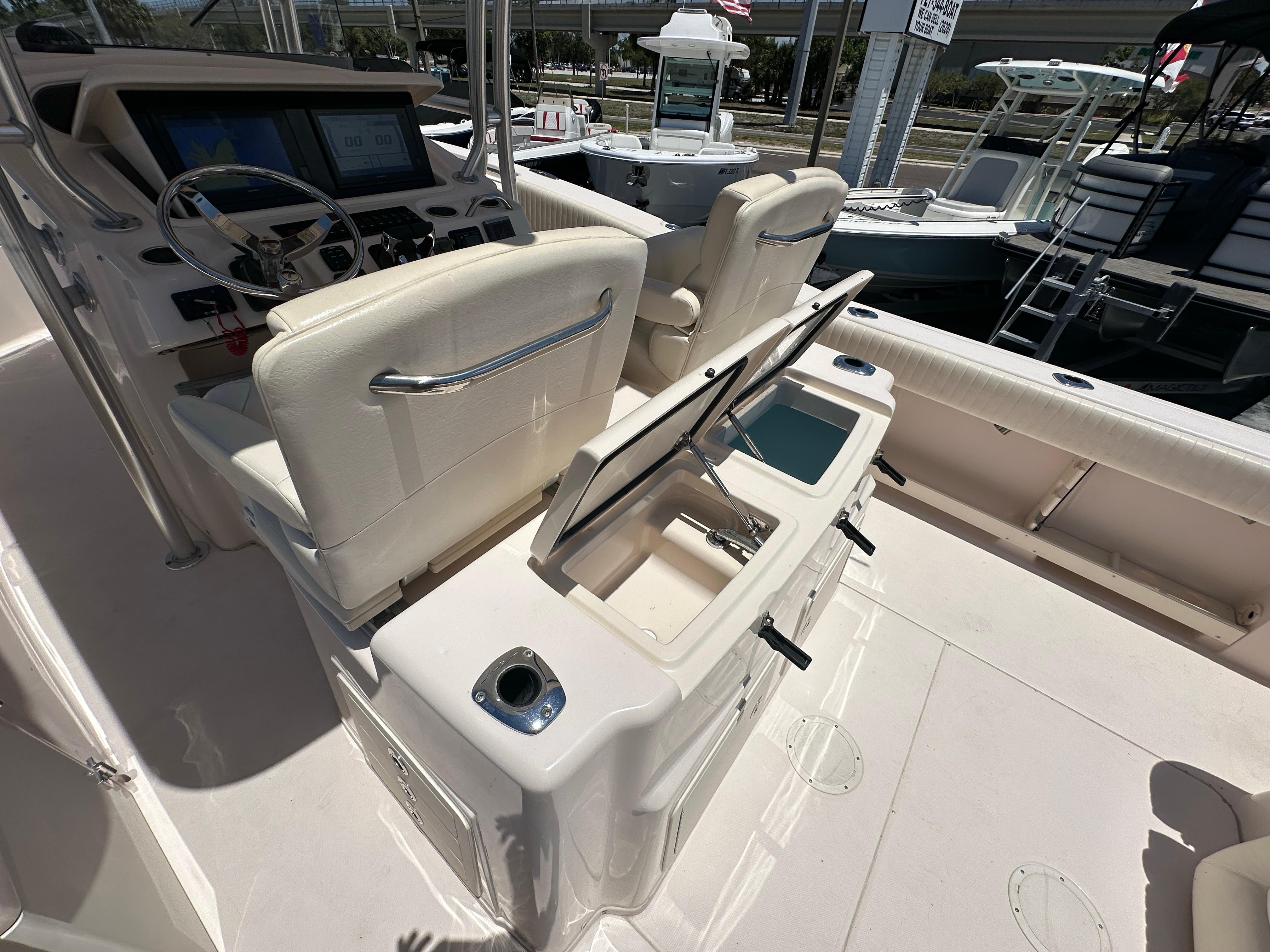 2013 Grady-White Canyon 306 boat interior with helm and seating area.