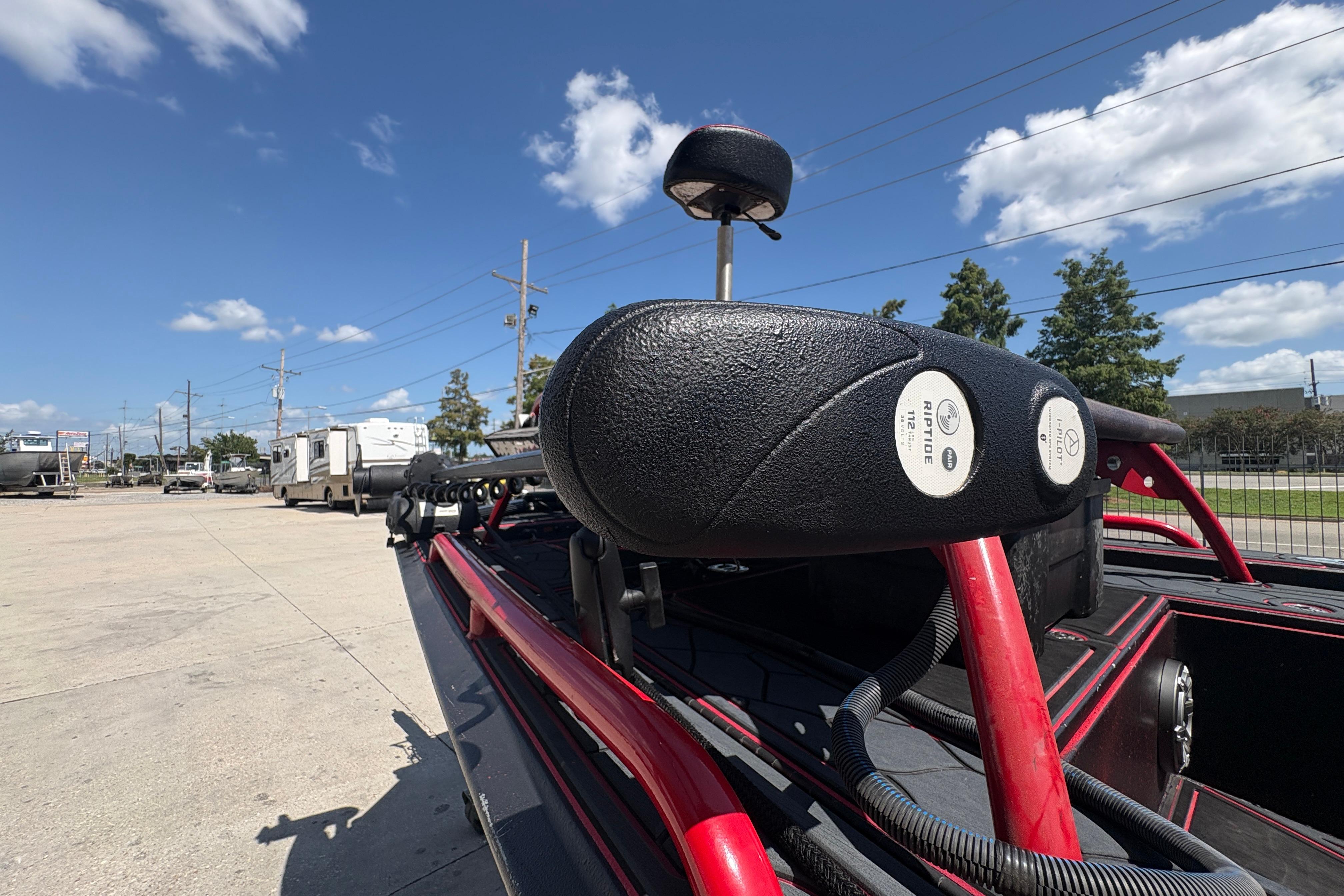 2018 Custom Swamp Shark 24' boat with Riptide motor, parked outdoors under blue sky.