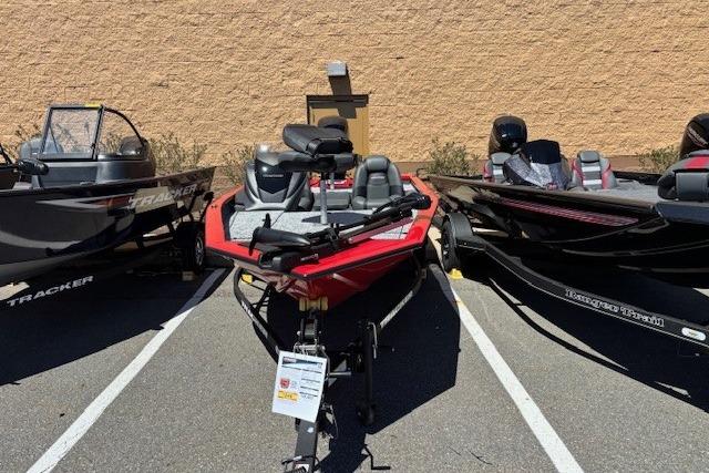 2026 Tracker Pro Team 175 boat displayed outdoors in a parking lot.