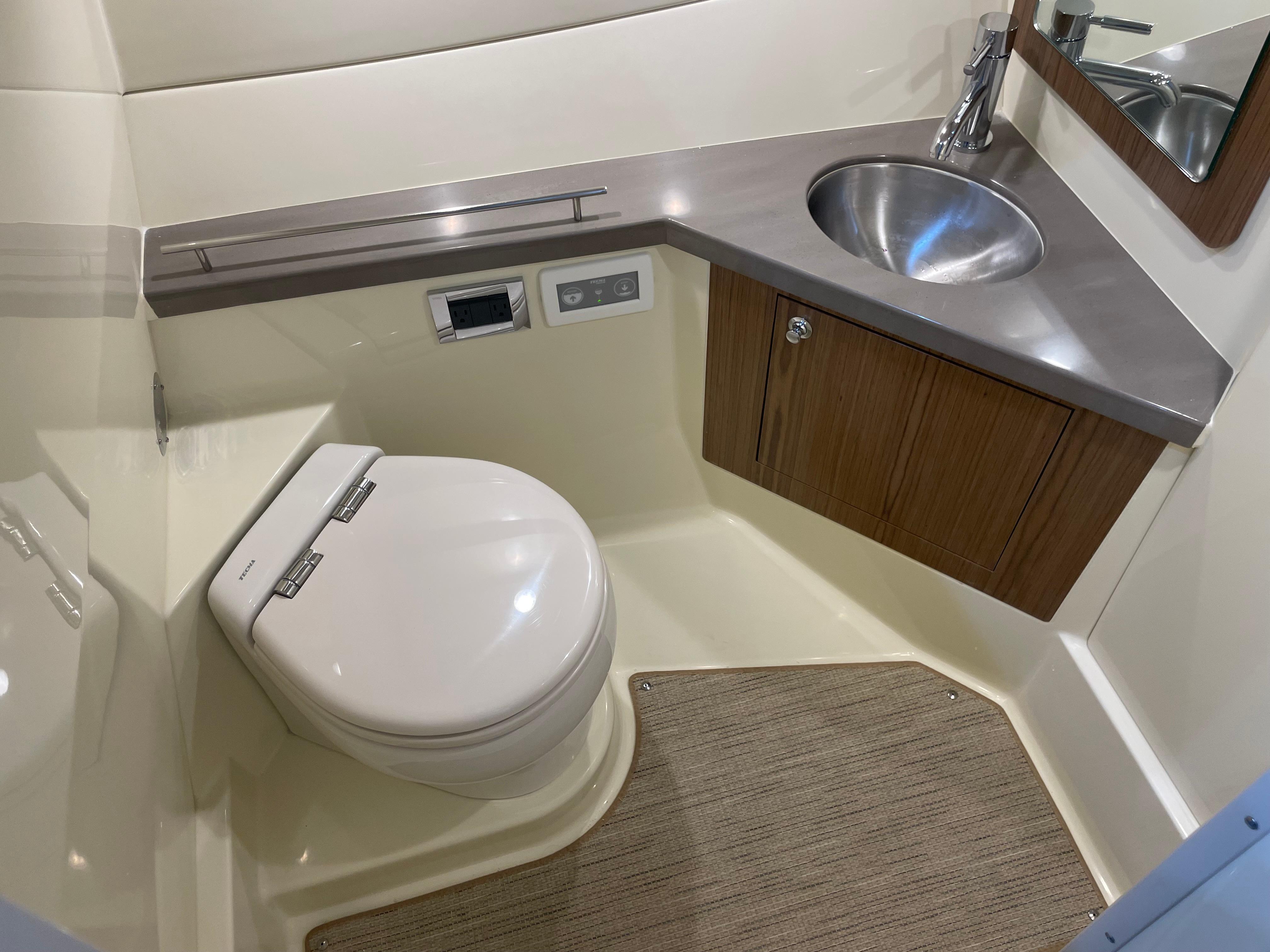 2024 Chris-Craft Calypso 32 boat bathroom with modern sink and toilet.