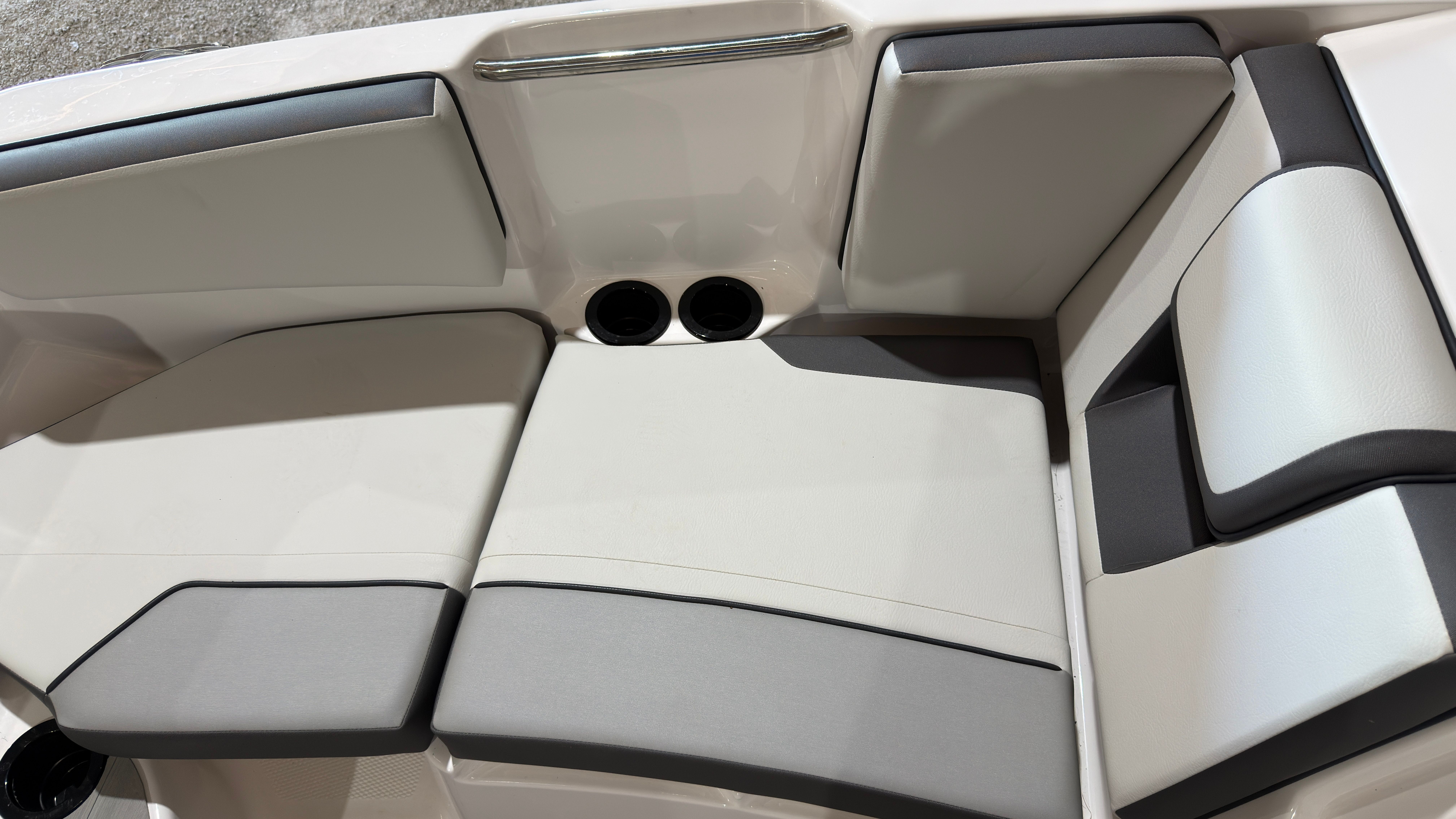 2024 Yamaha AR220 boat seating with gray and white upholstery.