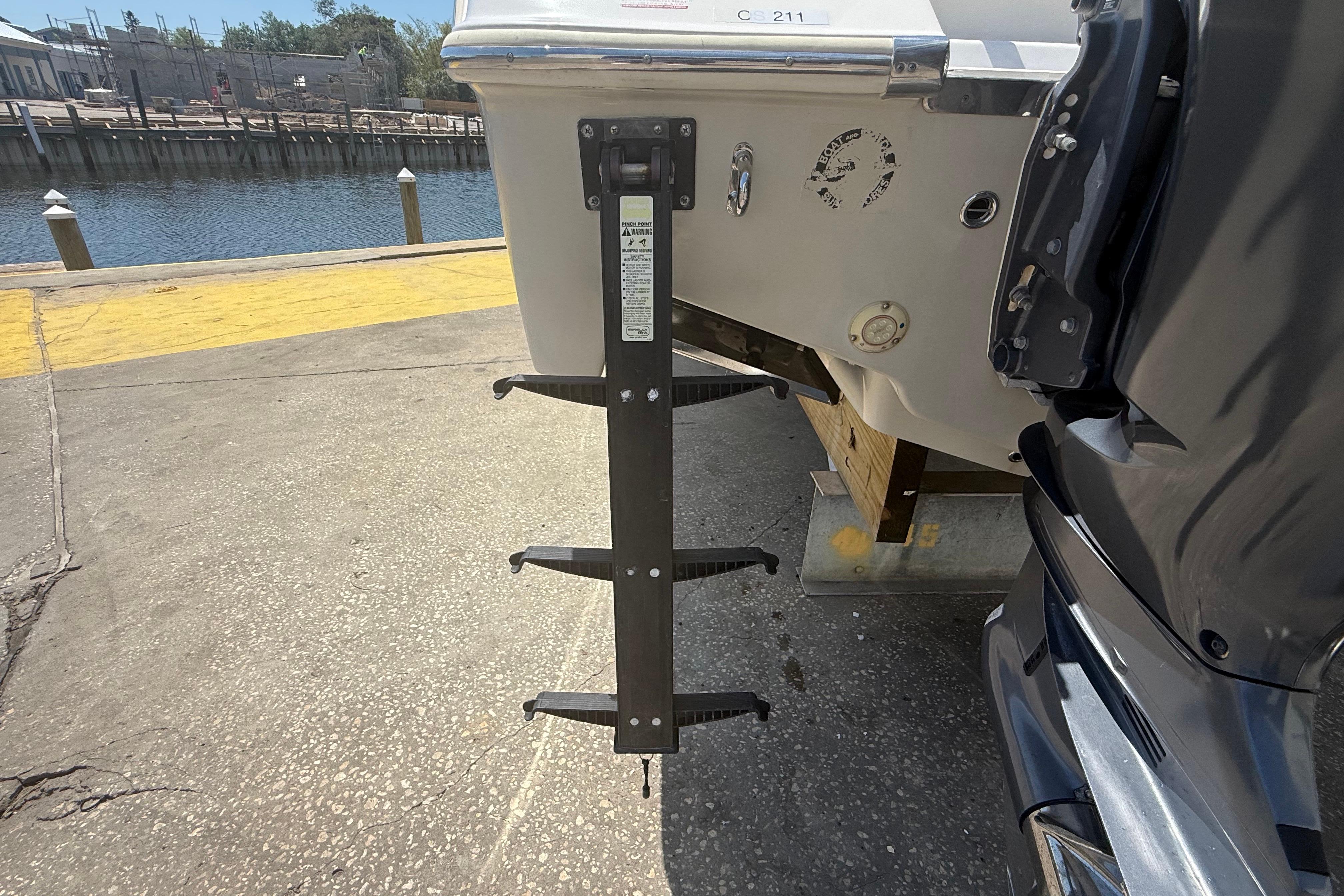 2019 Key West Billistic 281 Center Console boat ladder at dockside.