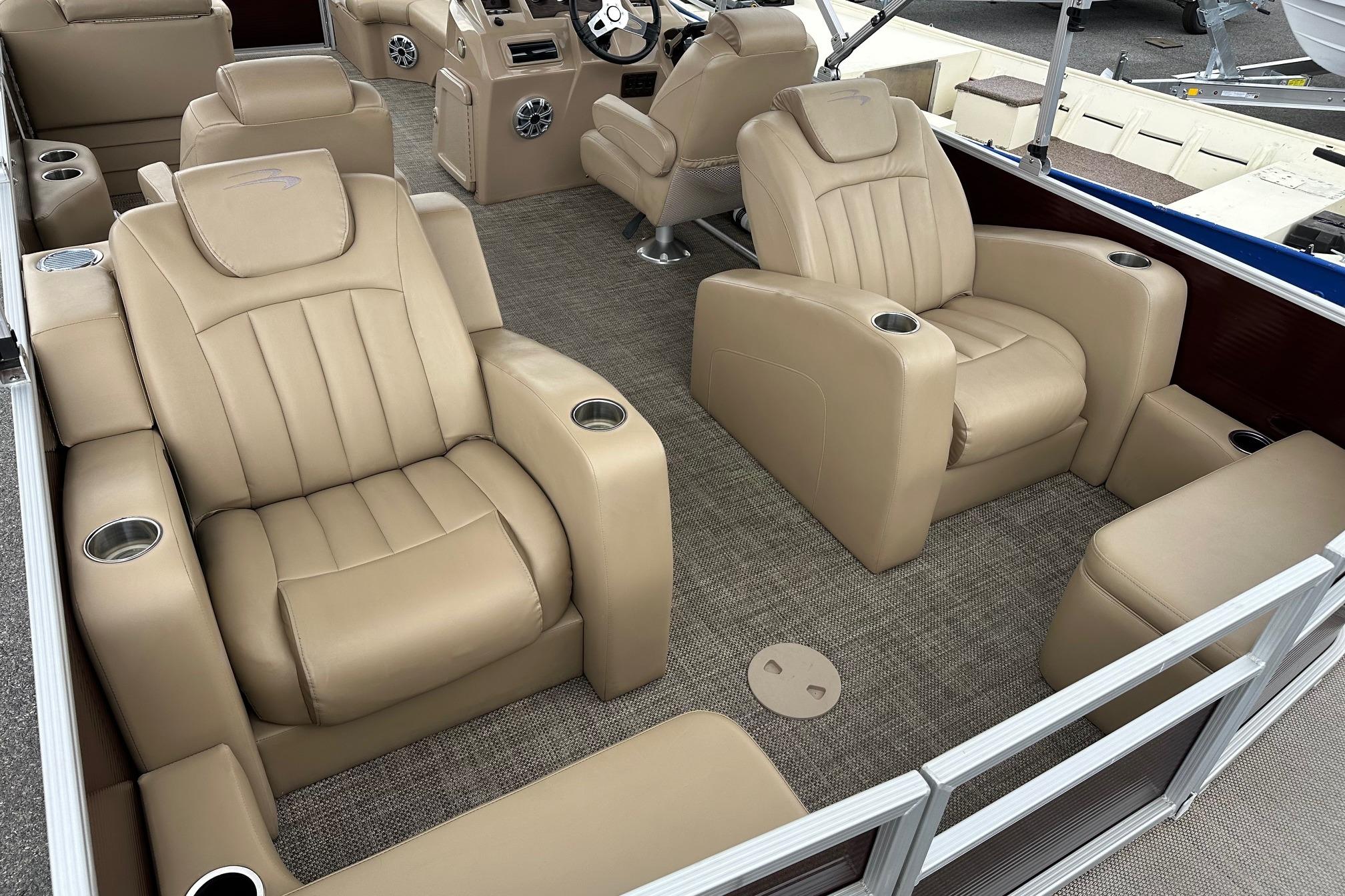 Luxurious seating on a 2016 Bennington 24 SCWX pontoon boat with beige upholstery.
