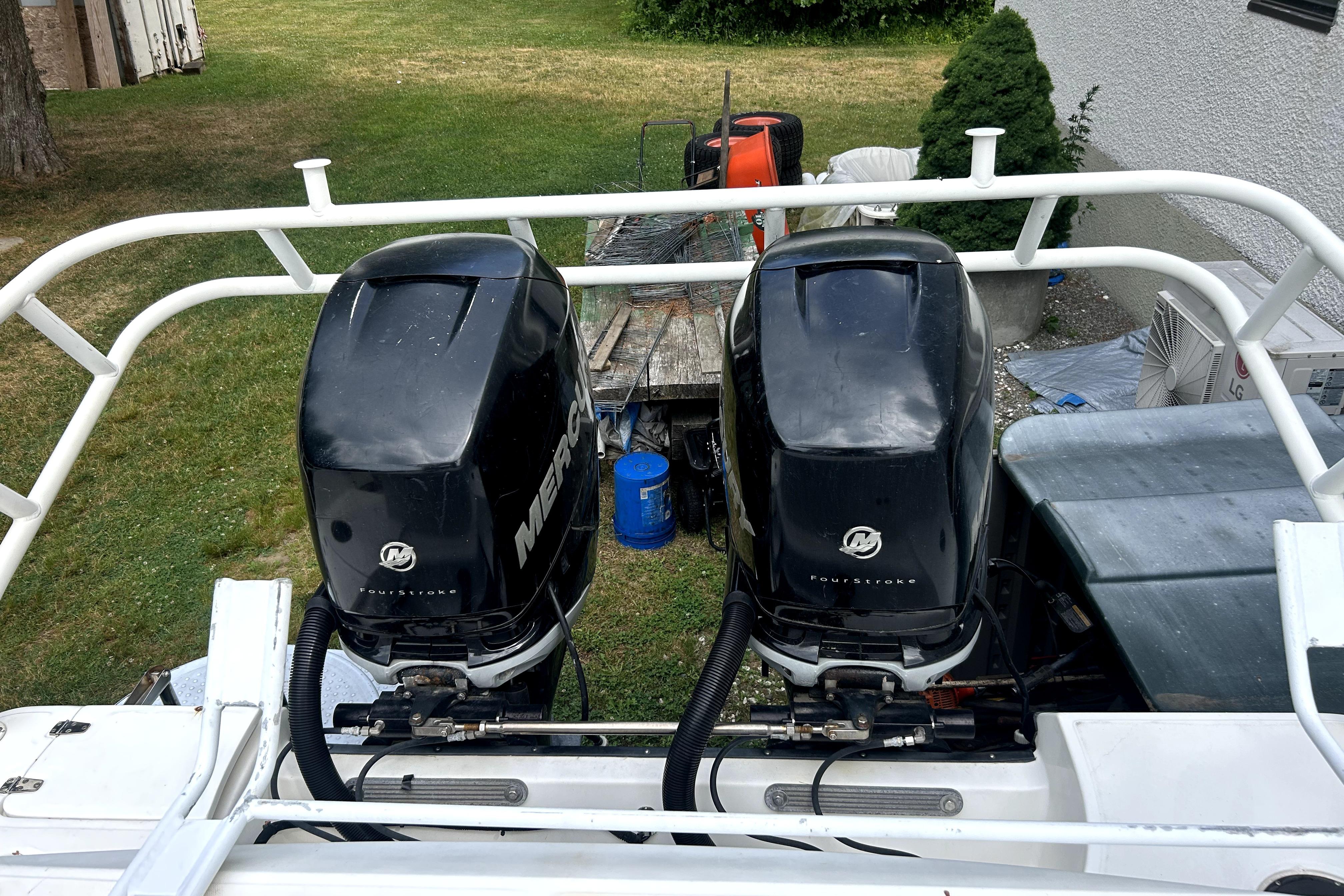 Twin Mercury outboard engines on a 2012 Boston Whaler 320 Outrage boat.