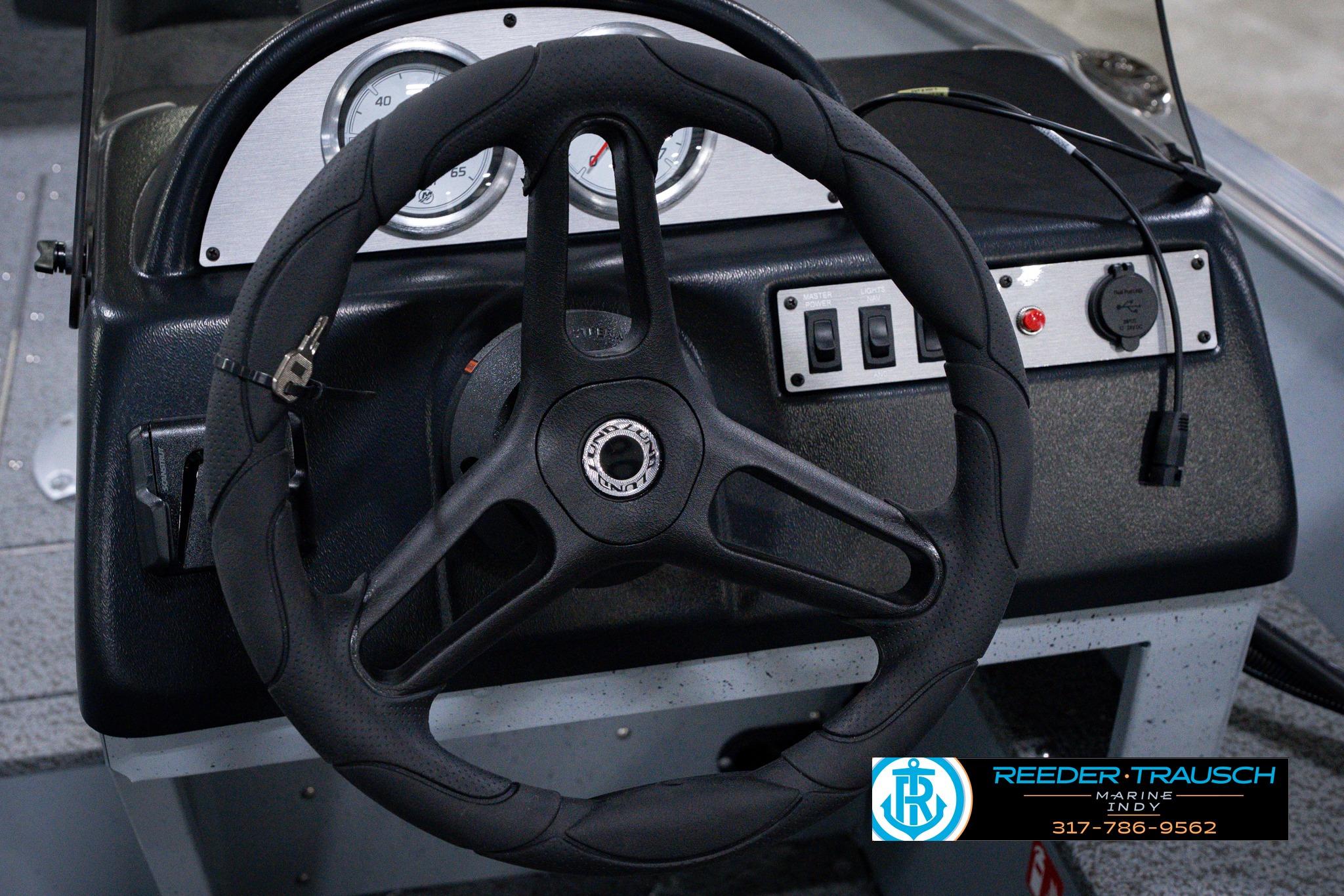Steering wheel and dashboard of 2026 Lund 1600 Fury SS boat.