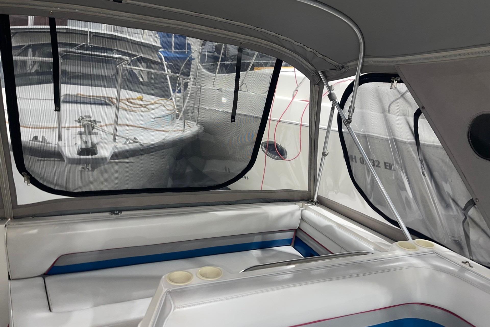 1992 Chaparral Signature 30 boat interior with seating and window view.