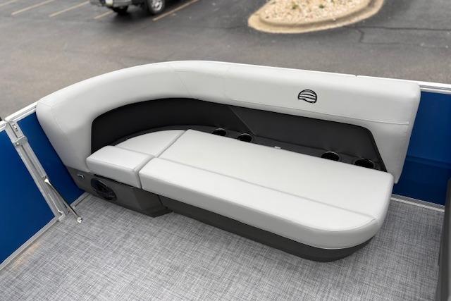 2026 Sun Tracker Party Barge 16 DLX interior seating with gray upholstery and cup holders.