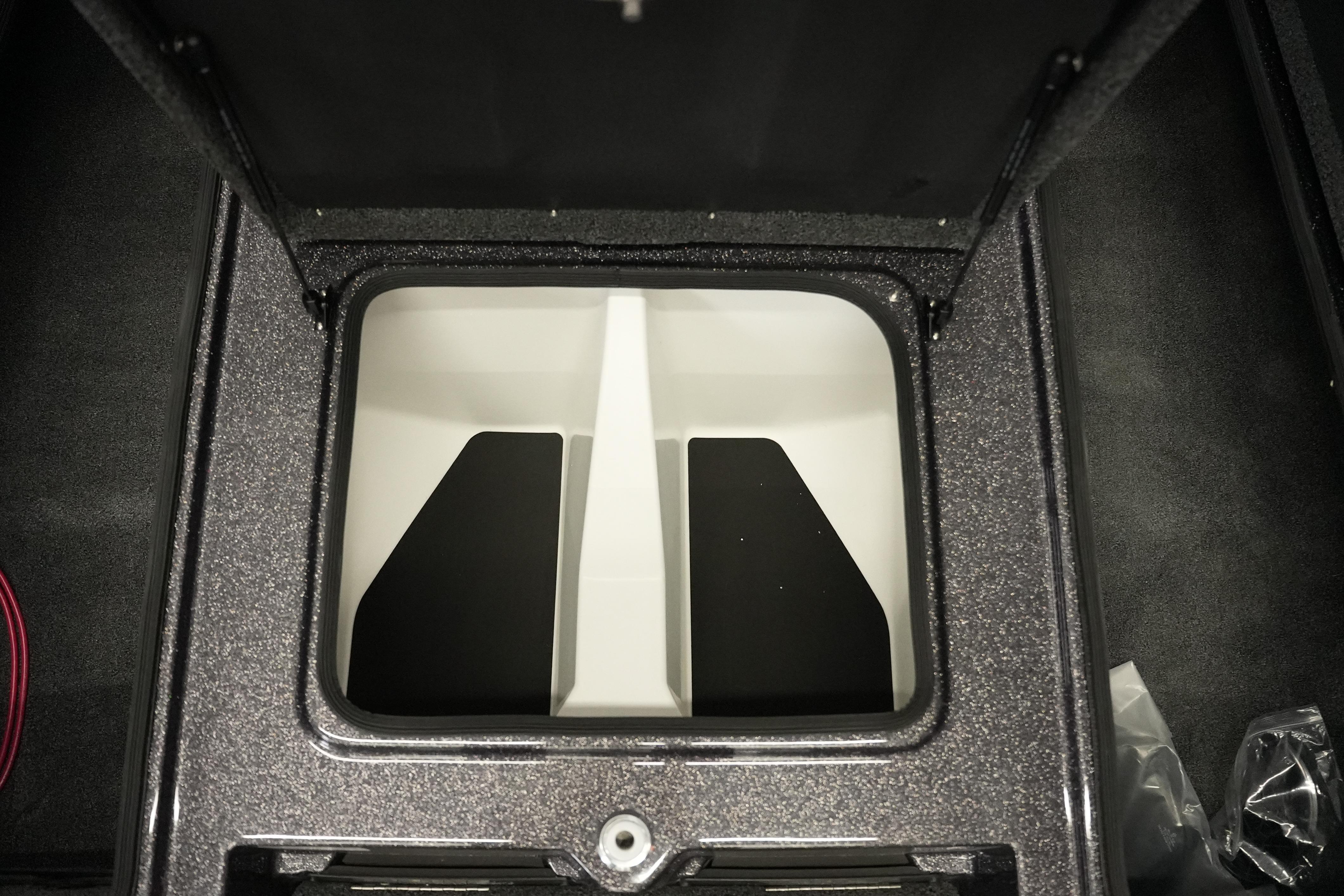 2026 Bass Cat Puma STS storage compartment with open lid, showcasing interior design.