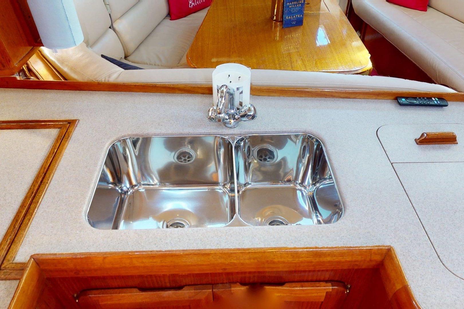 Luxurious kitchen sink area in a 1997 Hunter Legend 40.5 yacht interior.