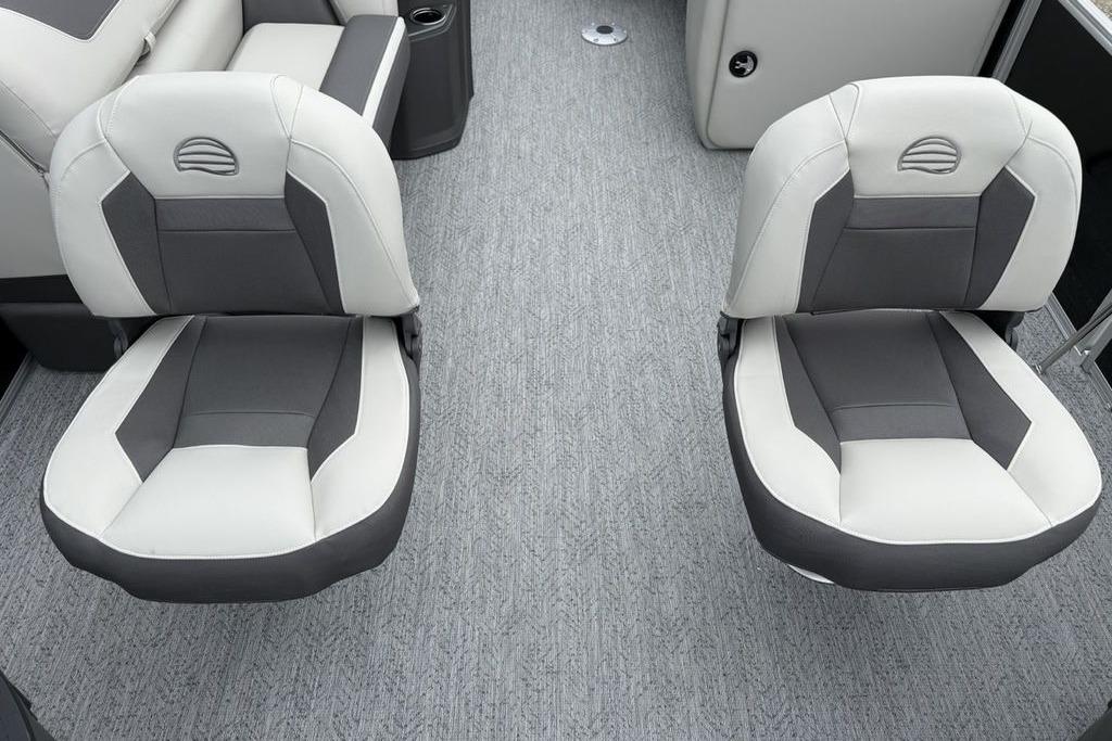 2026 Sun Tracker Fishin' Barge 20 DLX boat seats, featuring gray and white upholstery.
