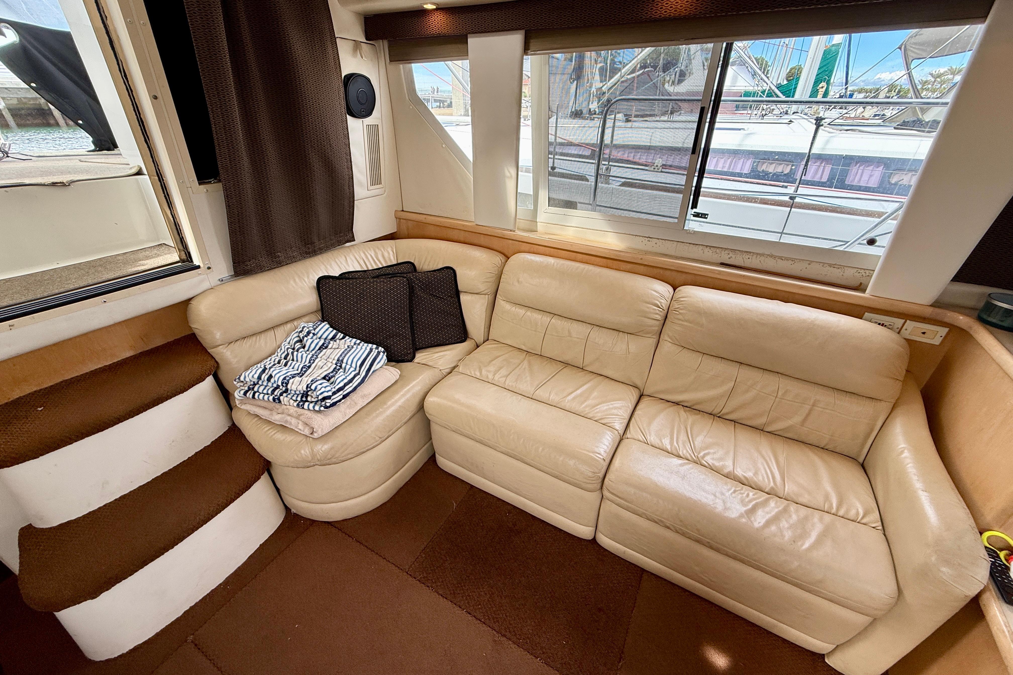 Interior of 1997 Carver 355 Aft Cabin Motor Yacht with beige leather seating.
