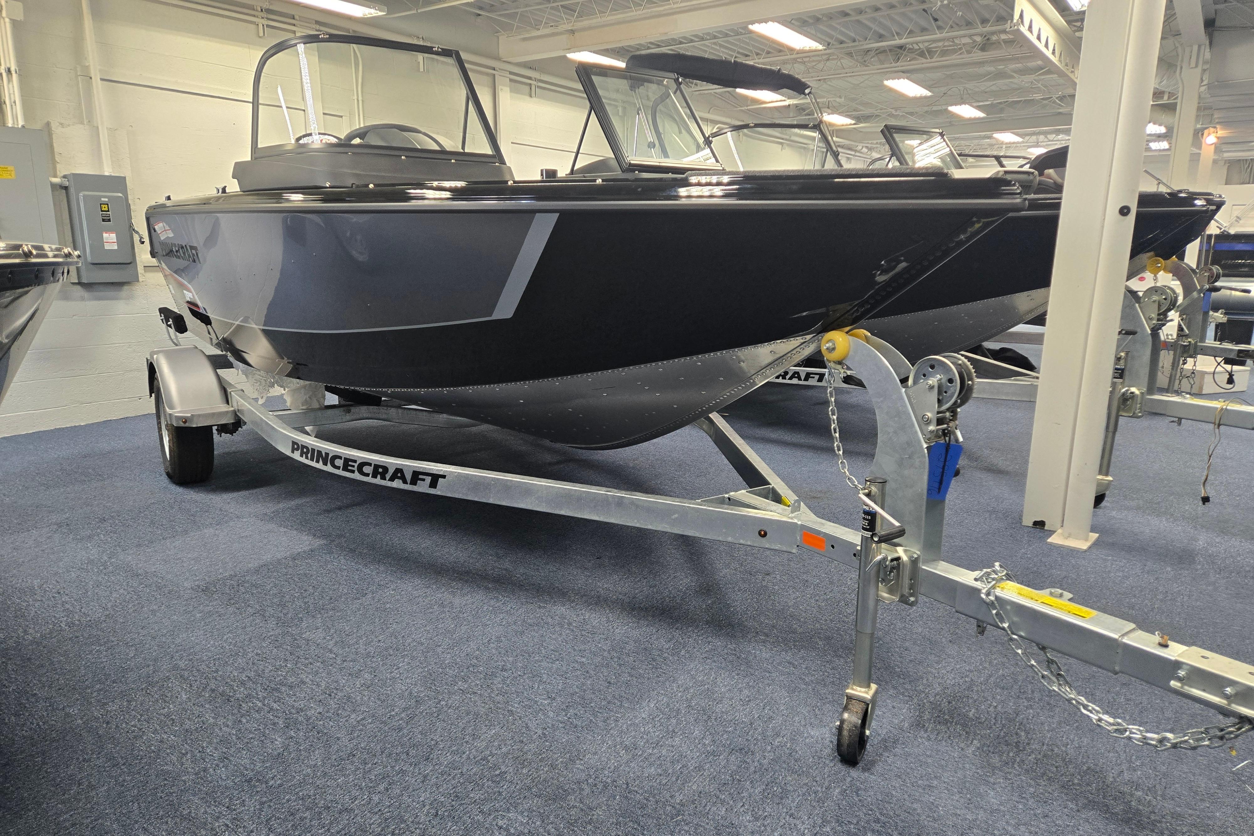 2026 Princecraft Sport 175 MAX boat on trailer in showroom.