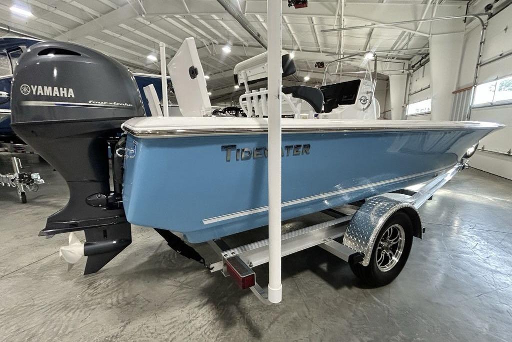 2026 Tidewater 1910 Bay Max boat with Yamaha engine in a showroom.