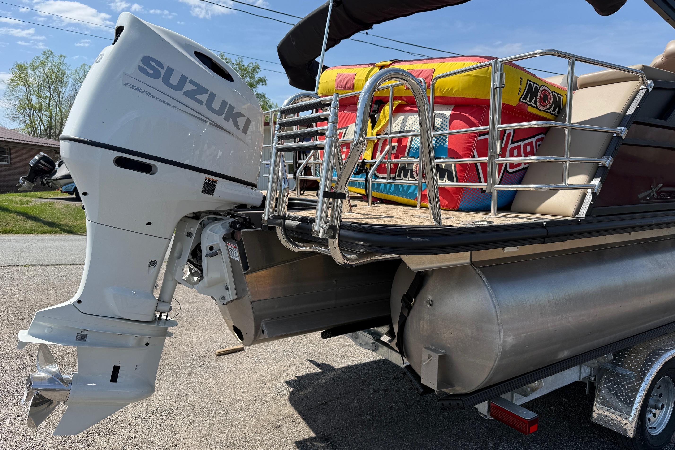 2024 Sylvan X1 CLZ DH pontoon boat with Suzuki outboard motor.